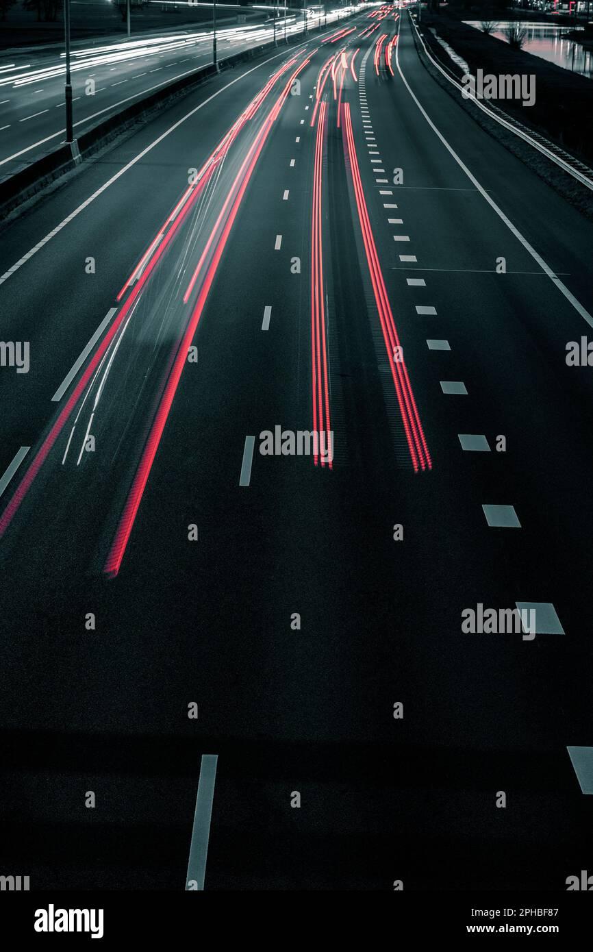 Traffic trails on a motorway at night Stock Photo