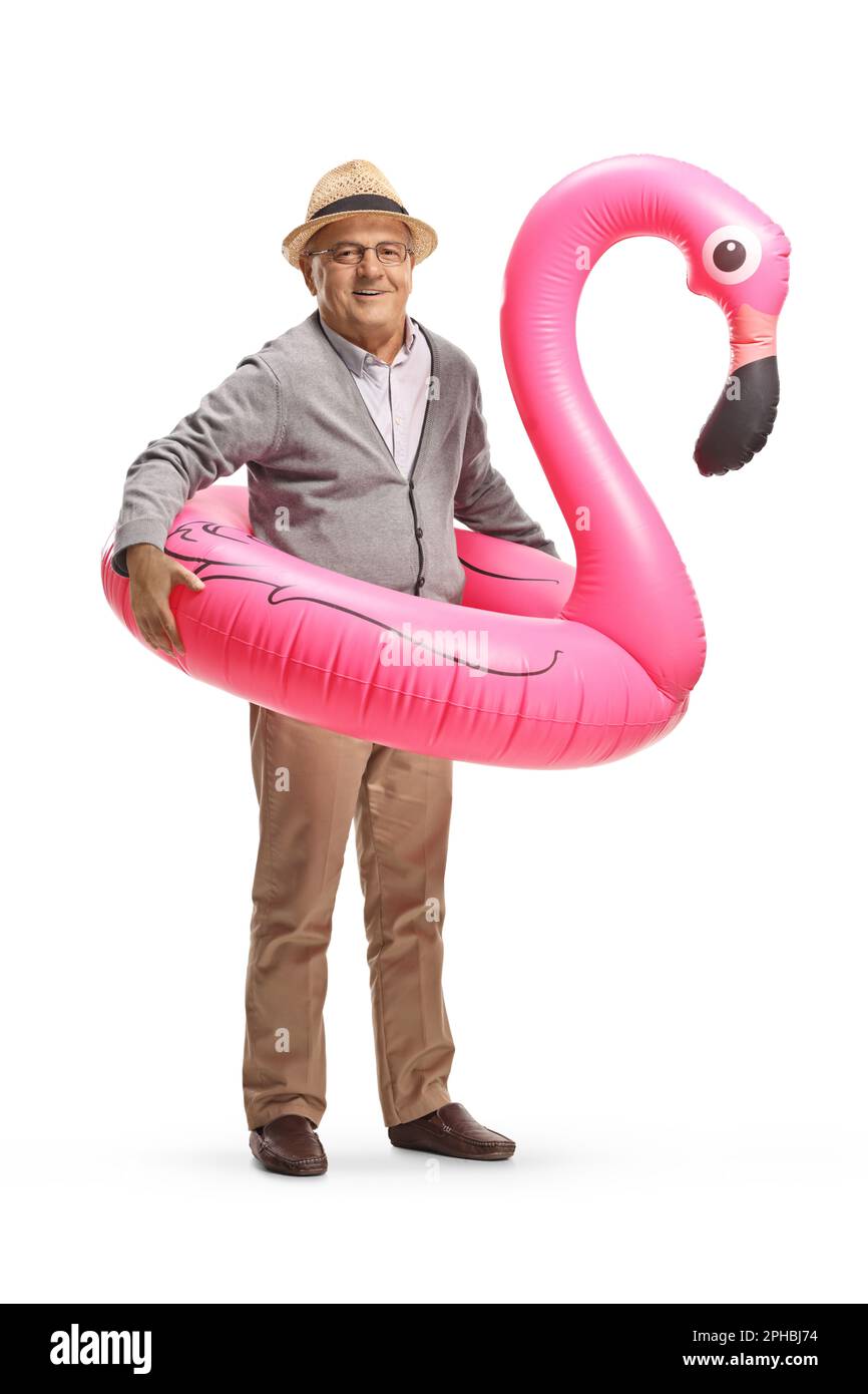 Elderly man with a big inflatable flamingo rubber ring isolated on ...