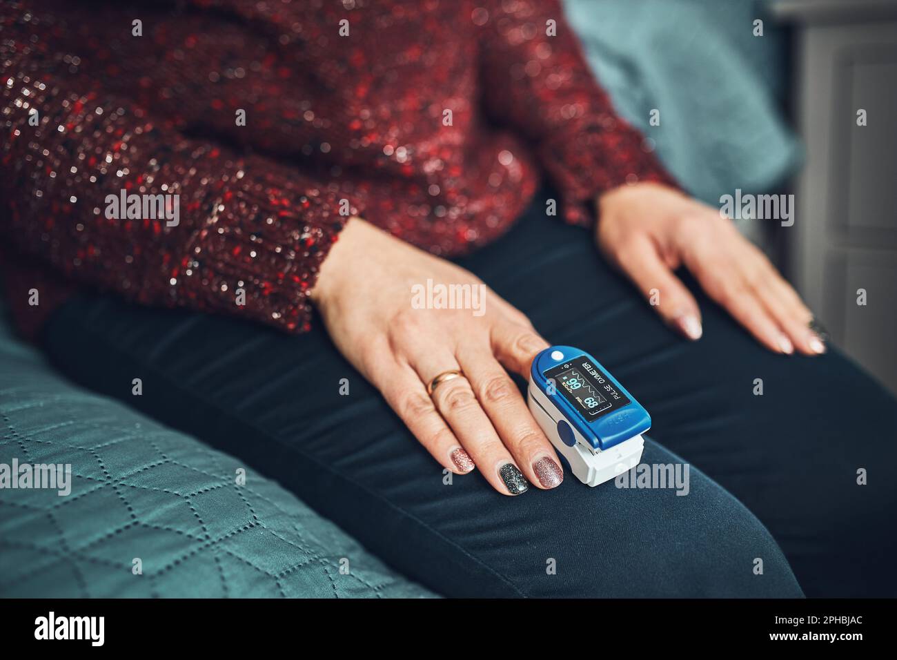 Woman measuring the degree of oxygen saturation of the blood and heart
