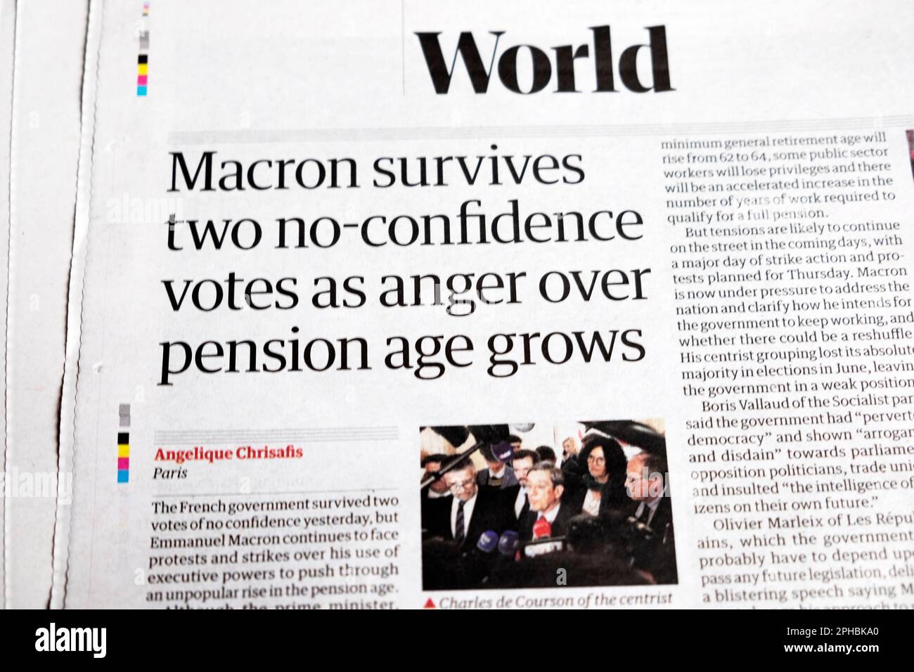 Emmanuel 'Macron survives two no-confidence votes as anger over pension age grows' Guardian newspaper headline France pensions article 21 March 2023 Stock Photo