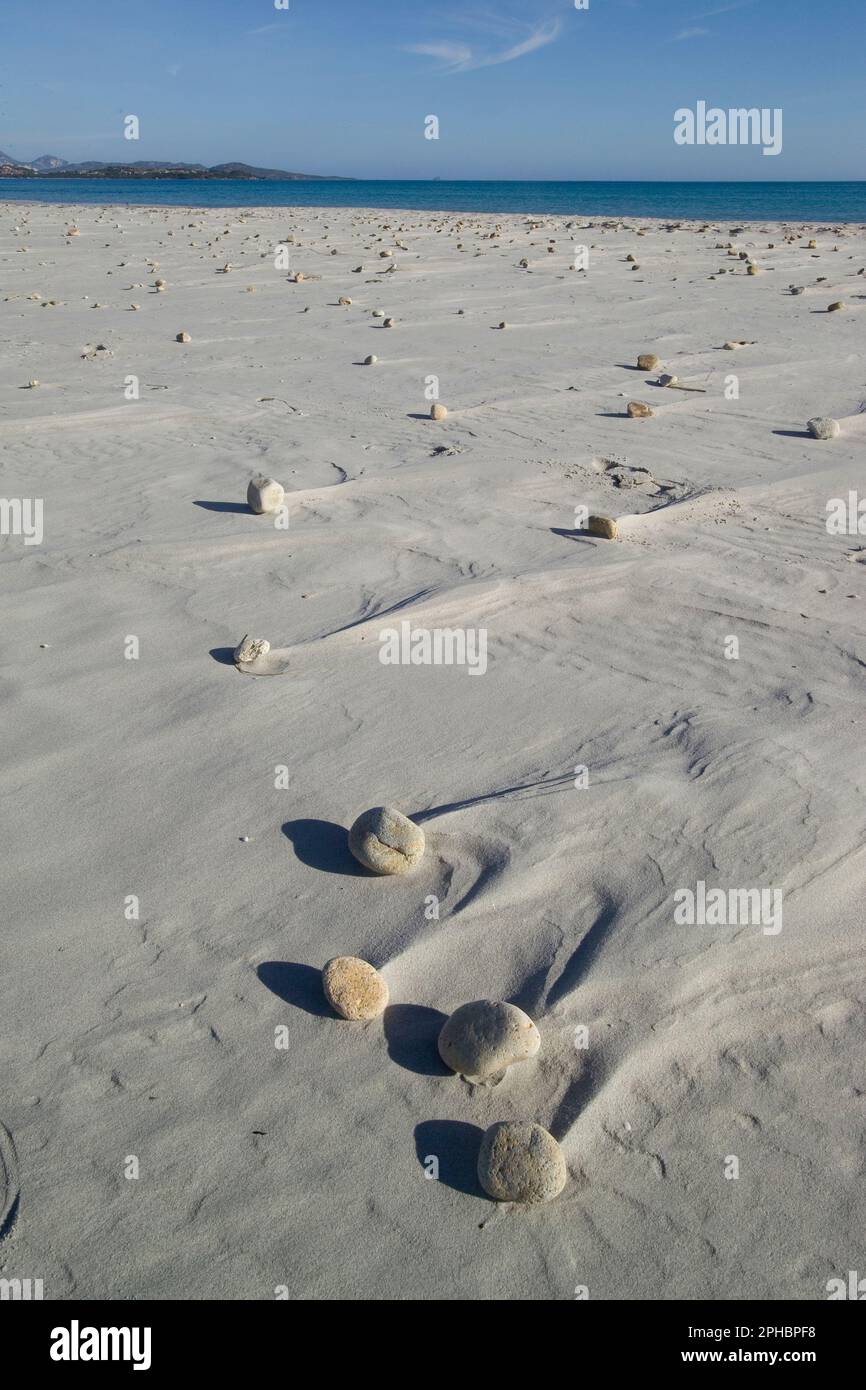 Shapes blown by the wind and surf around the pebbles on the beach of la Cinta. Siniscola, Sardinia Italy Stock Photo