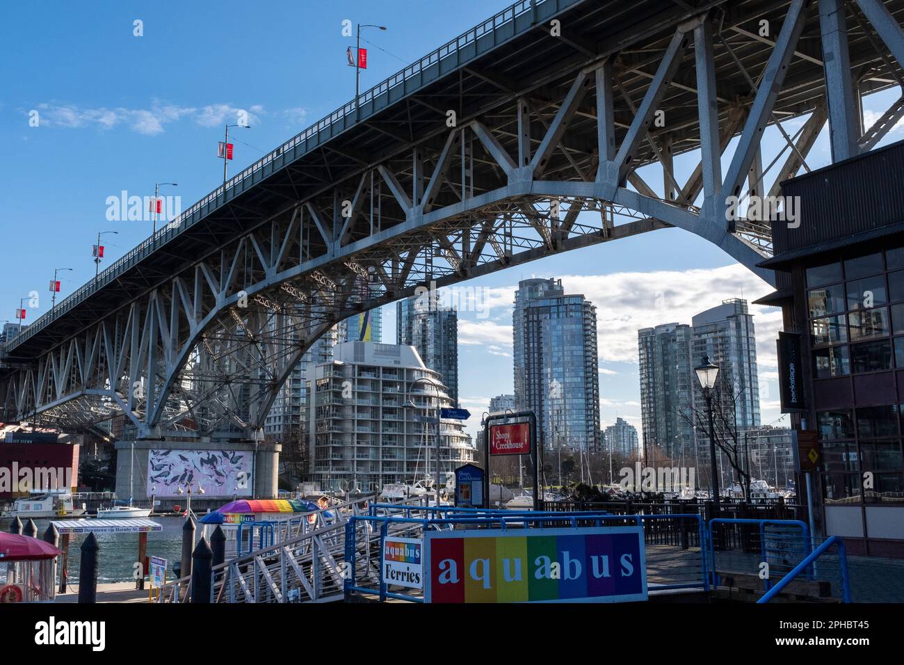 The Granville Bridge passes over the streets, shops and wharf of ...