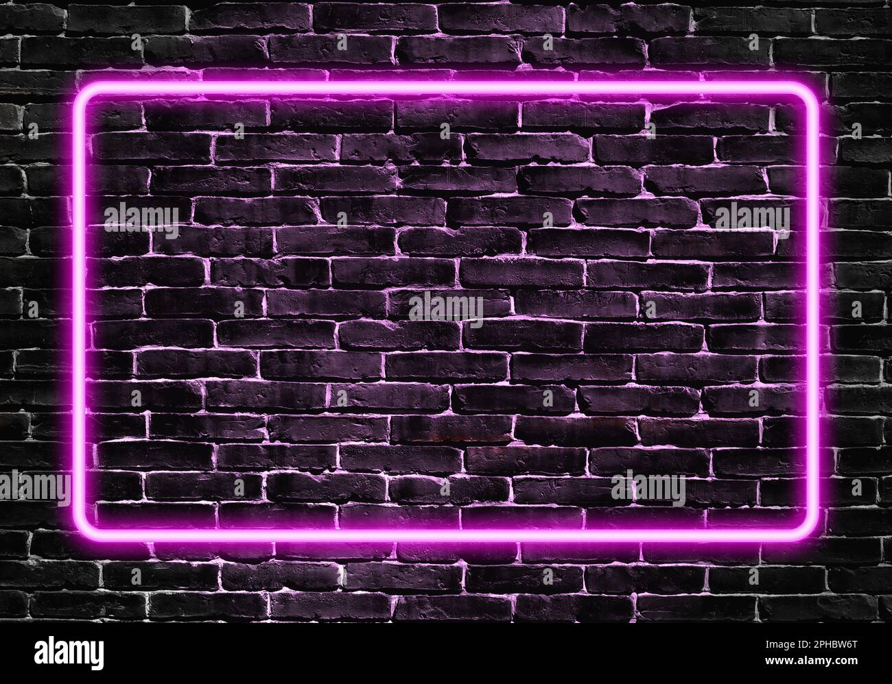 Neon purple light glowing frame on a dark brick wall texture. Stock Photo