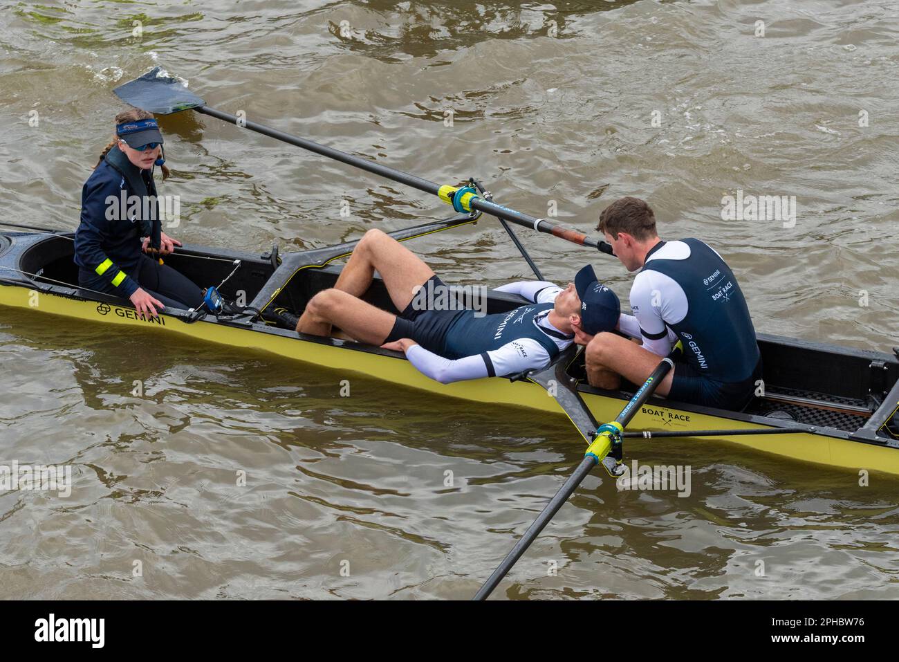 Boat Race 2023. Oxford stroke Felix Drinkall collapsed after the finish line and was taken to hospital to recover. Held by rower Tassilo von Mueller Stock Photo