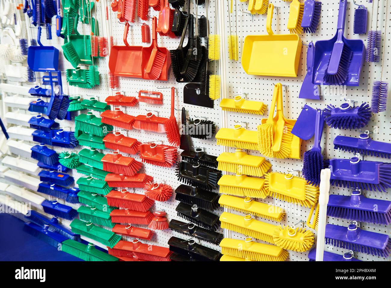 Plastic household brushes in the hardware store Stock Photo Alamy