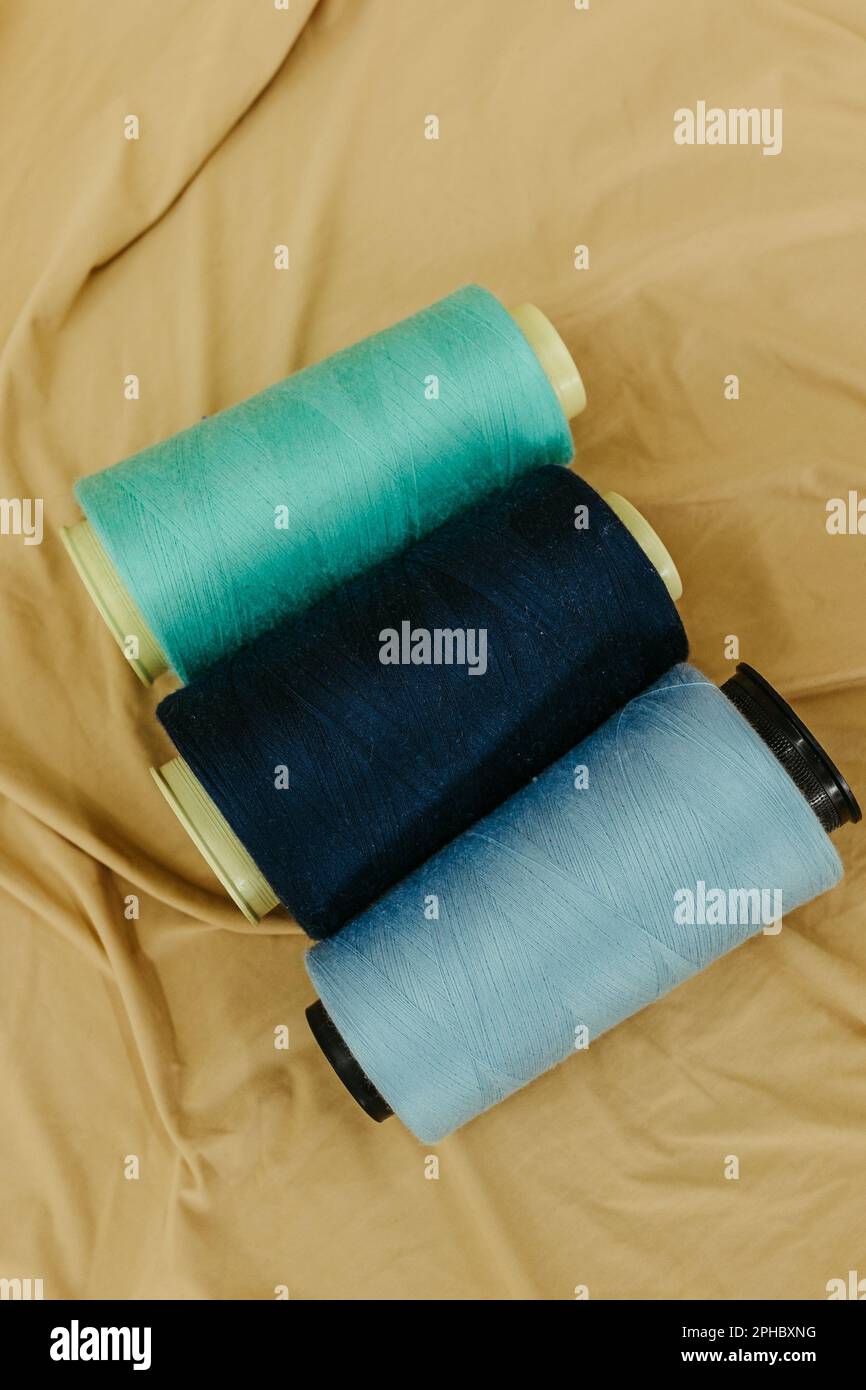 A vivid vertical image of assorted colors of threads spooled Stock ...