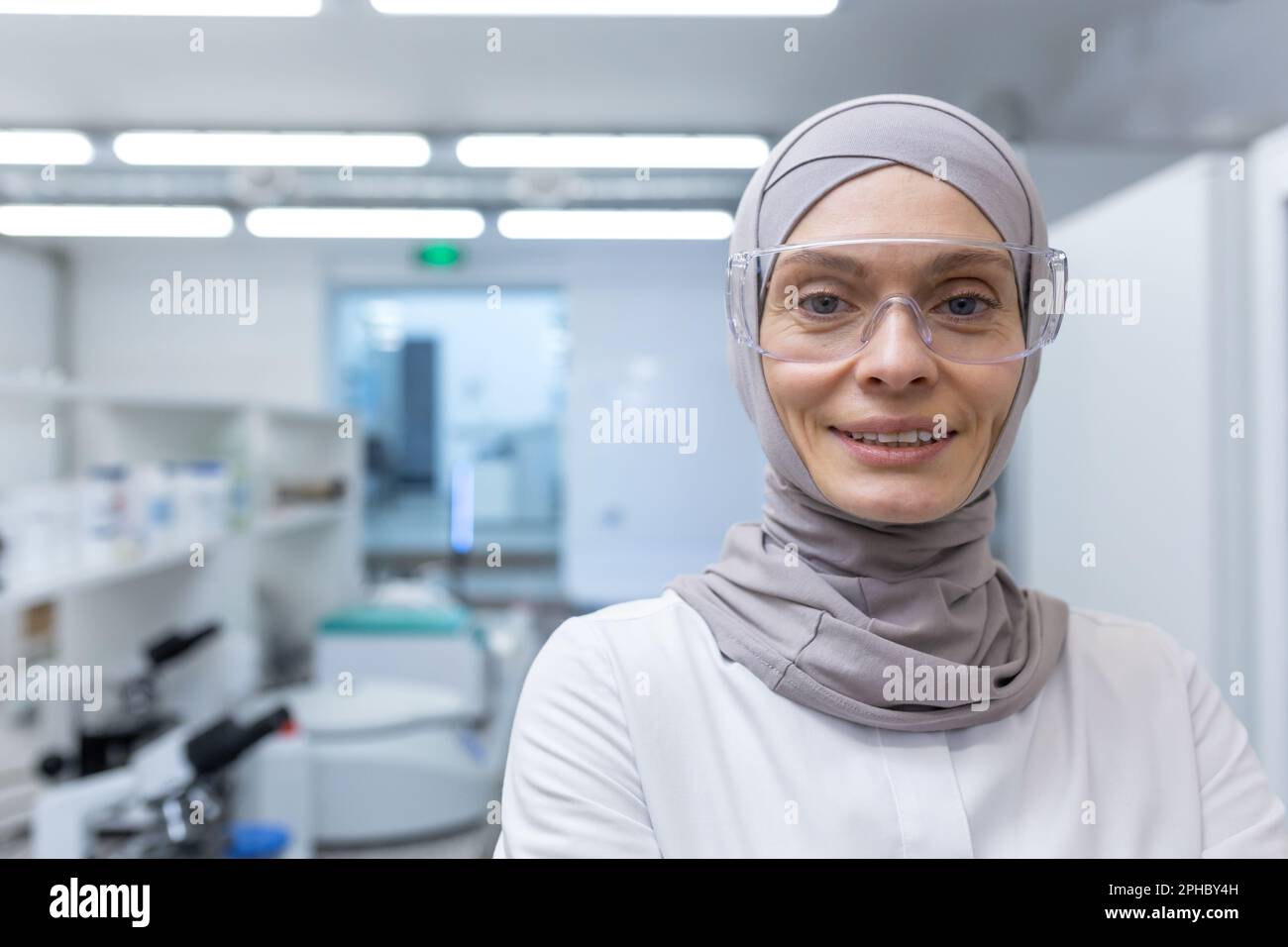 Closeup photo. Portrait of a young Muslim female lab assistant
