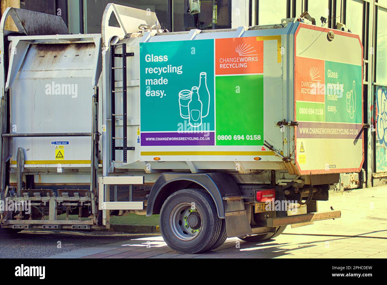 glass collection recycling truck collecting from bars Stock Photo