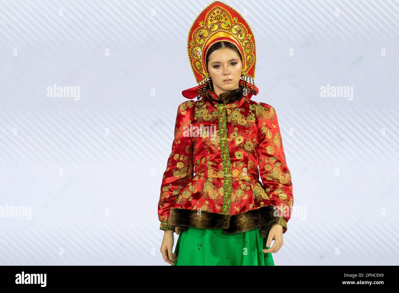 Moscow, Russia. 26th of March, 2023. A model presents traditional Russian national costumes on a runbway as part of the show 'Edges of the World' at the Kids Fashion Week children's fashion festival at the Central Children's Store on Lubyanka in Moscow, Russia Stock Photo