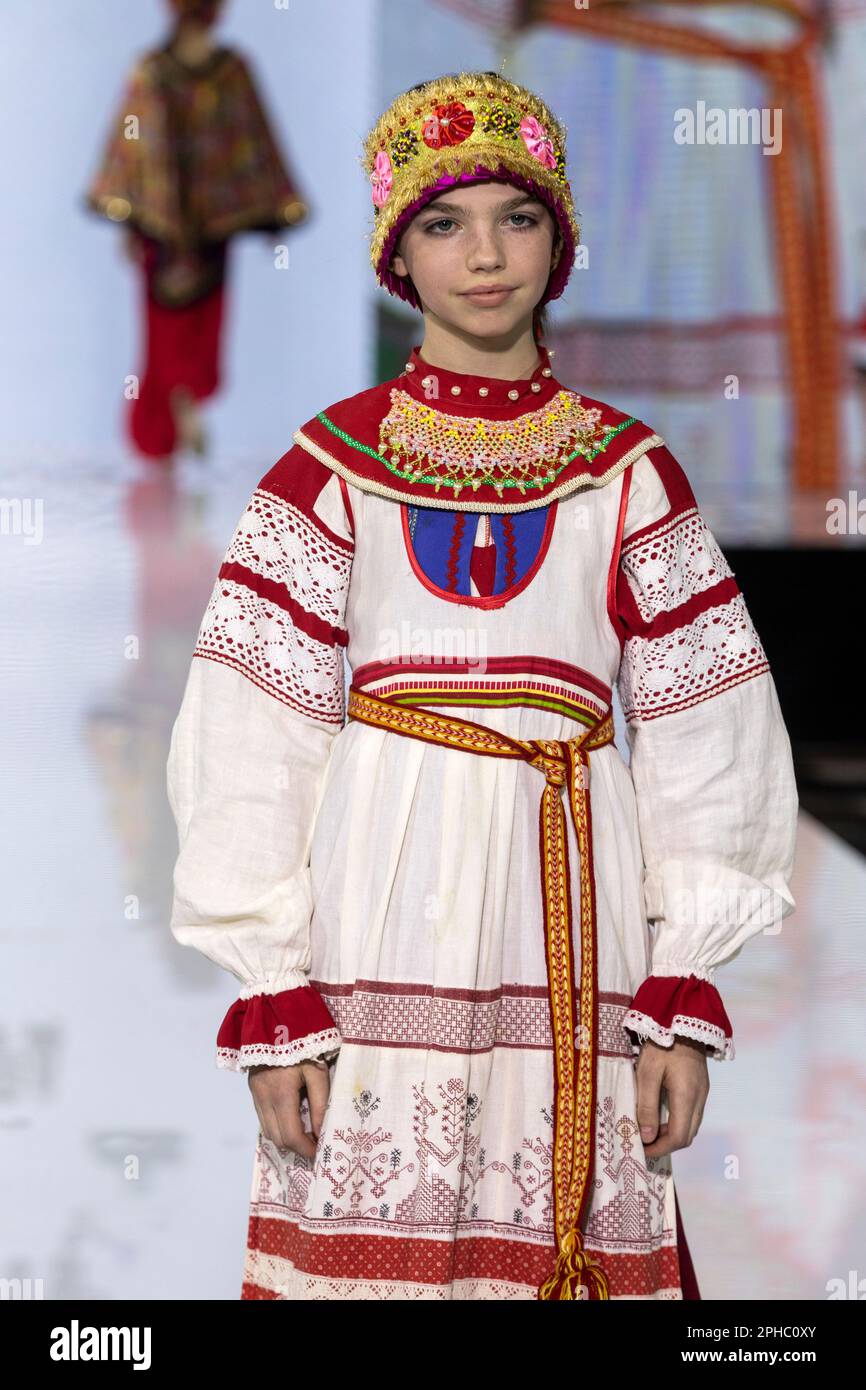 Moscow, Russia. 26th of March, 2023. Models present traditional Russian national costumes on a runbway as part of the show 'Edges of the World' at the Kids Fashion Week children's fashion festival at the Central Children's Store on Lubyanka in Moscow, Russia Stock Photo