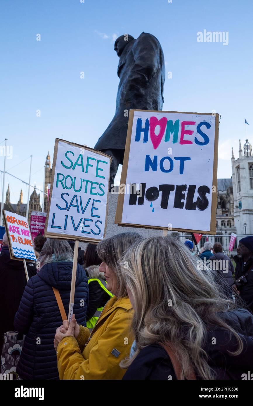 London, UK.  27 March 2023.  People by the statue of Sir Winston Churchill at a rally in Parliament Square opposing the The Illegal Migration Bill which is being debated by MPs in the House of Commons.  Credit: Stephen Chung / Alamy Live News Stock Photo