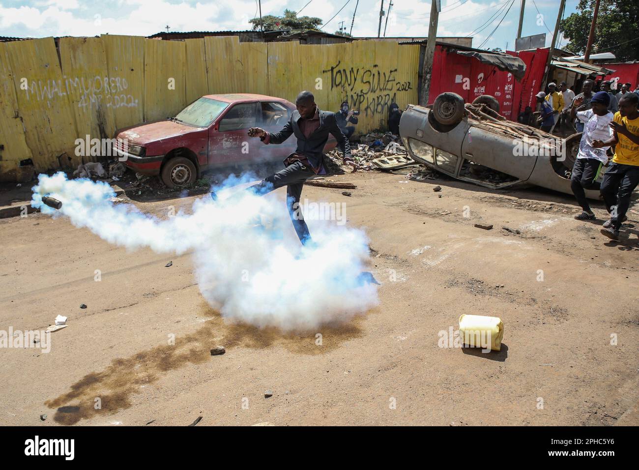 nairobi-kenya-27th-mar-2023-a-protestor-kicks-a-teargas-canister