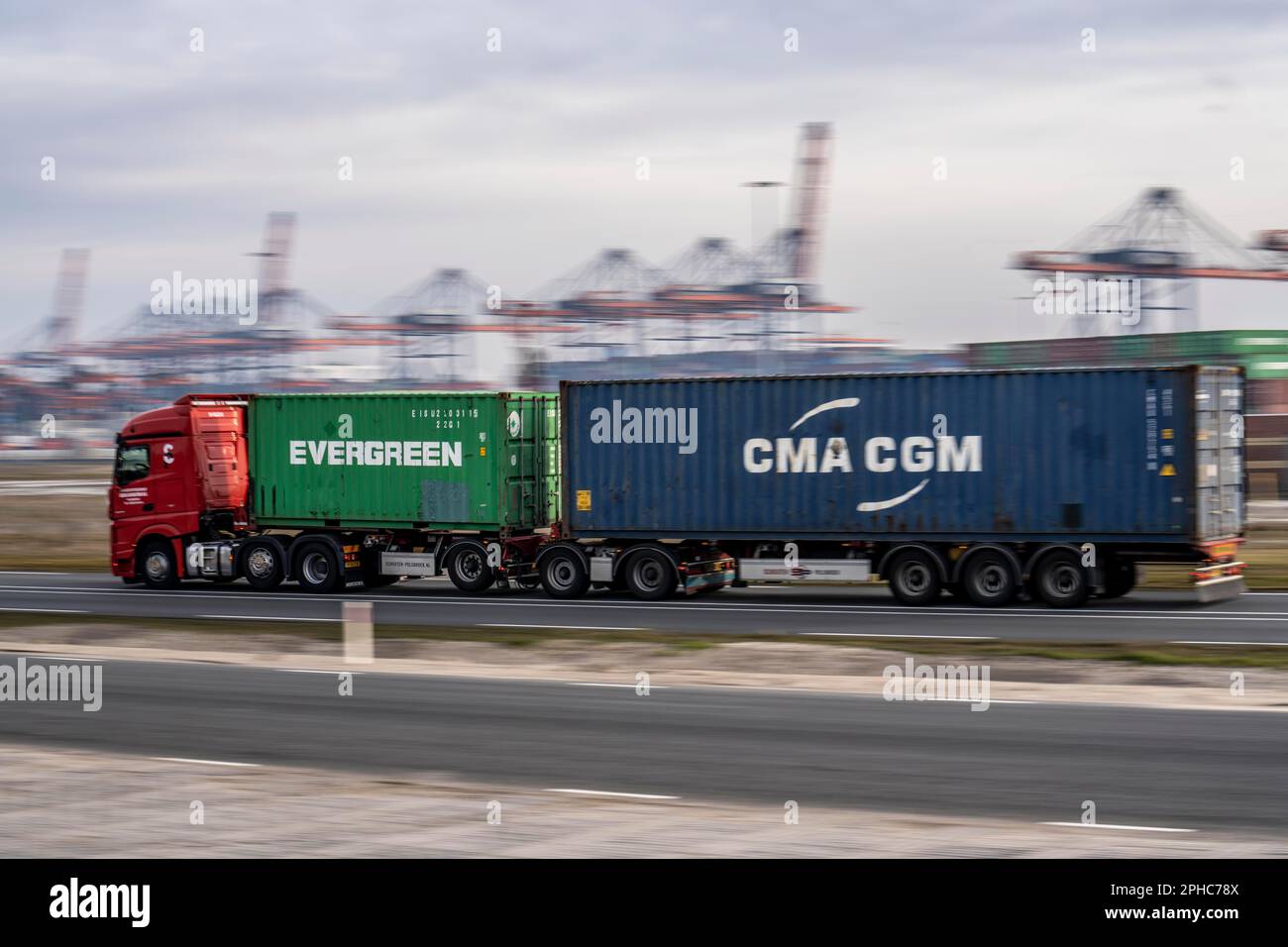 Container truck, bringing containers to Euromax Container Terminal, the seaport of Rotterdam, the Netherlands, deep sea port Maasvlakte 2, on a man-ma Stock Photo