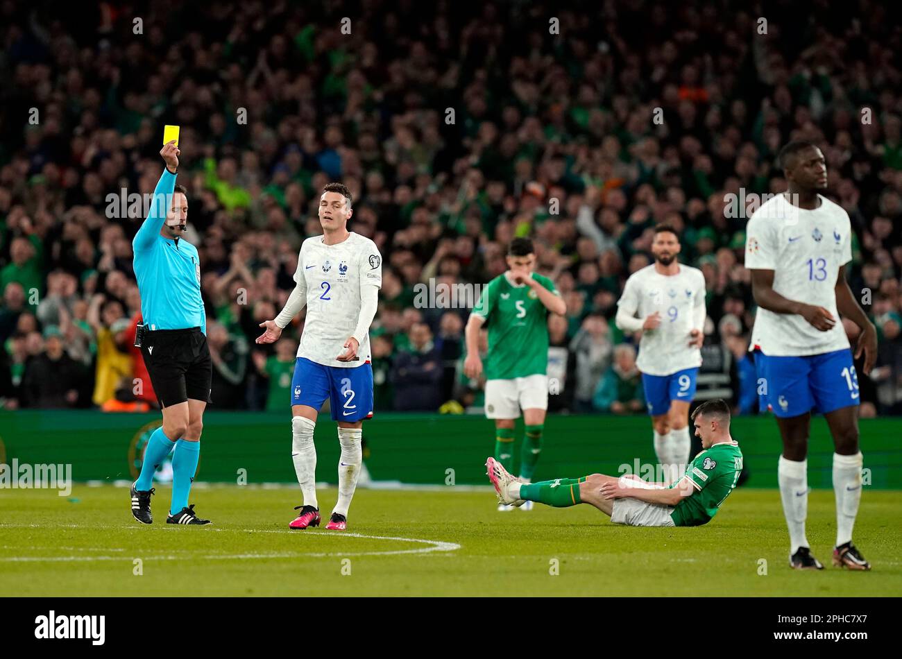 France's Benjamin Pavard is shown a yellow card for a foul on Republic ...