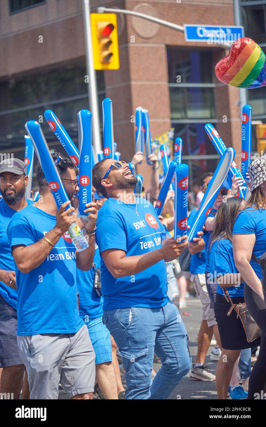 Toronto Ontario, Canada- June 26th, 2022: BMO bank employees marching in Toronto’s annual Pride parade. Stock Photo