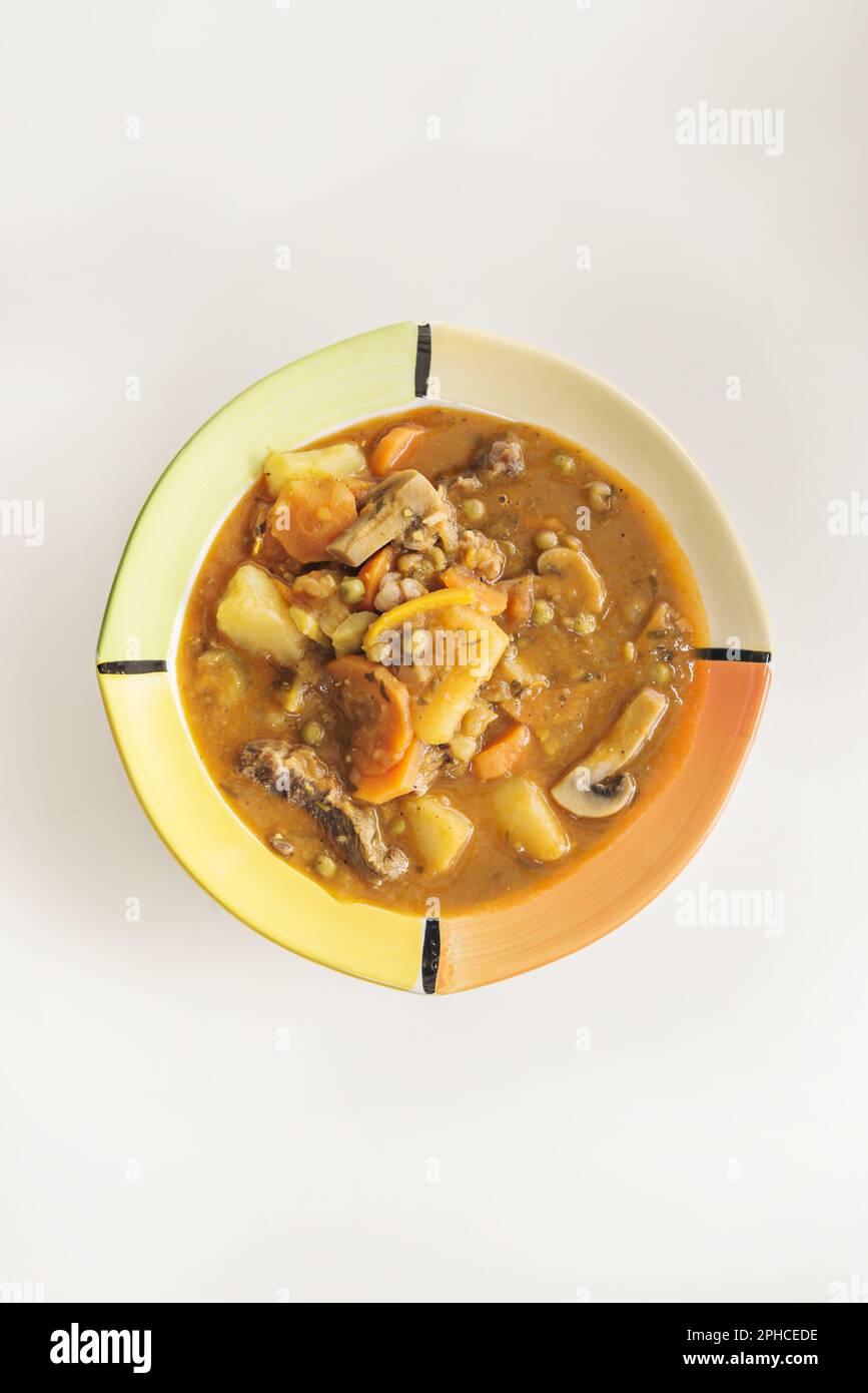 A stew is the cooking of a food in a closed container that prevents evaporation, conserving a large part of the initial juices and thus preserving the Stock Photo