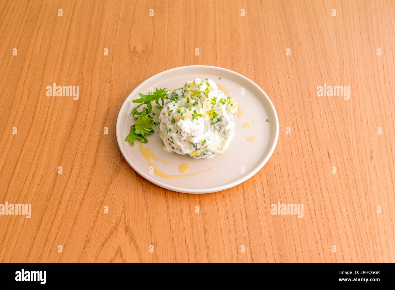 Tzatziki, the Greek version of cacık, is a cucumber and yogurt-based sauce, consumed in many dishes, especially meat Stock Photo