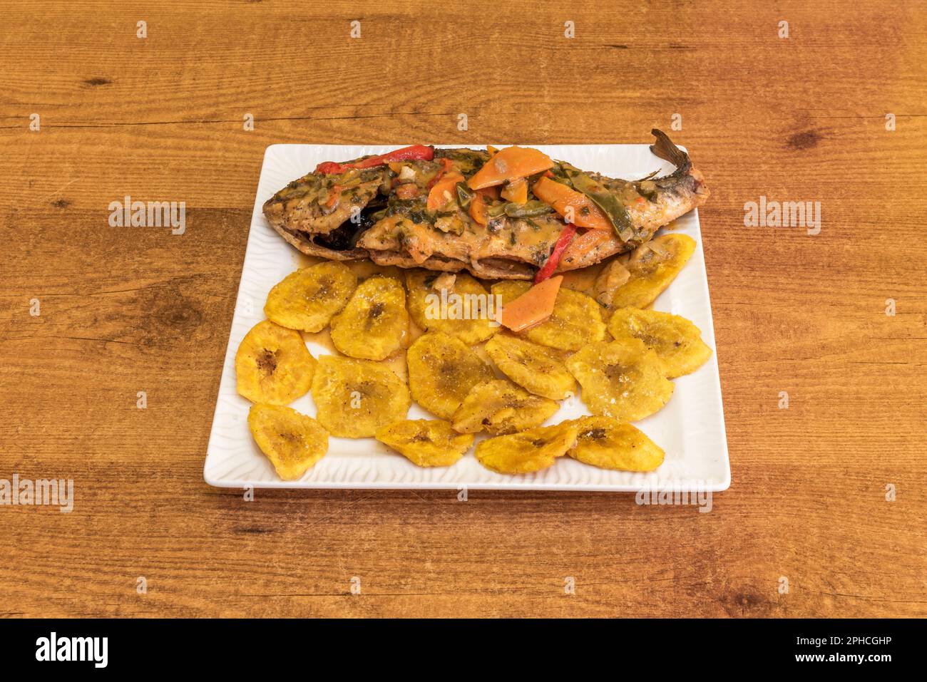 It is a fish stew made with onion, chili, tomato, coriander leaves and