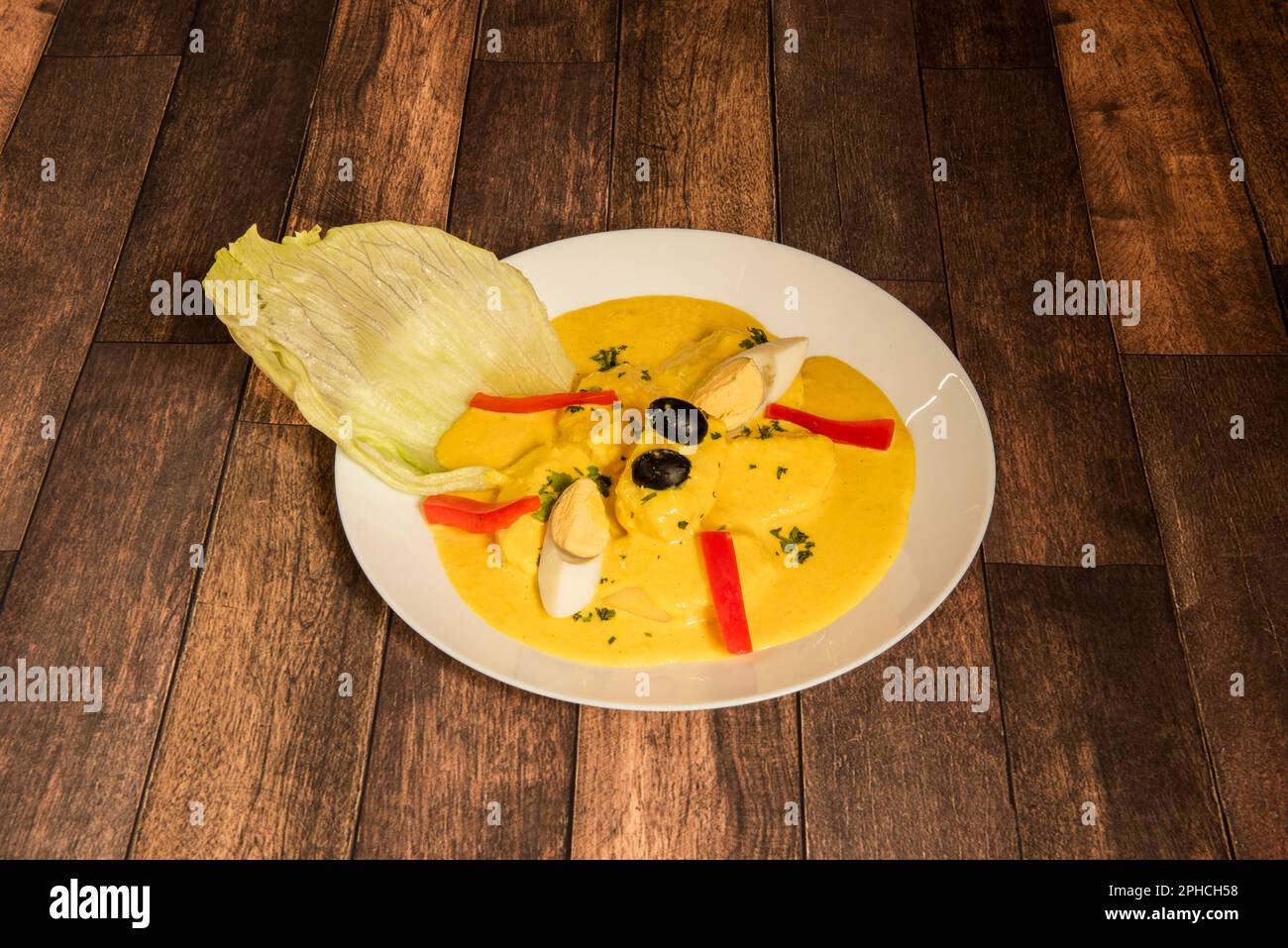 The elaboration consists of the preparation of a sauce whose base is fresh cheese and yellow chili. Evaporated milk and oil are added to form the semi Stock Photo