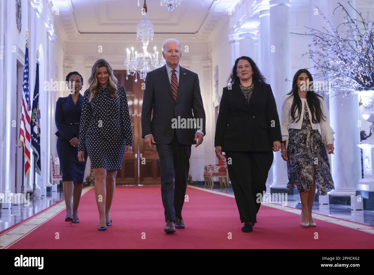 Washington, United States. 27th Mar, 2023. U.S. President Joe Biden joined by Administrator of the Small Business Administration (SBA) Isabella Casillas Guzman (2nd R) arrives at the SBA Women's Business Summit in the East Room of the White House in Washington, DC on Monday, March 27, 2023. (Photo by Oliver Contreras/UPI Credit: UPI/Alamy Live News Stock Photo