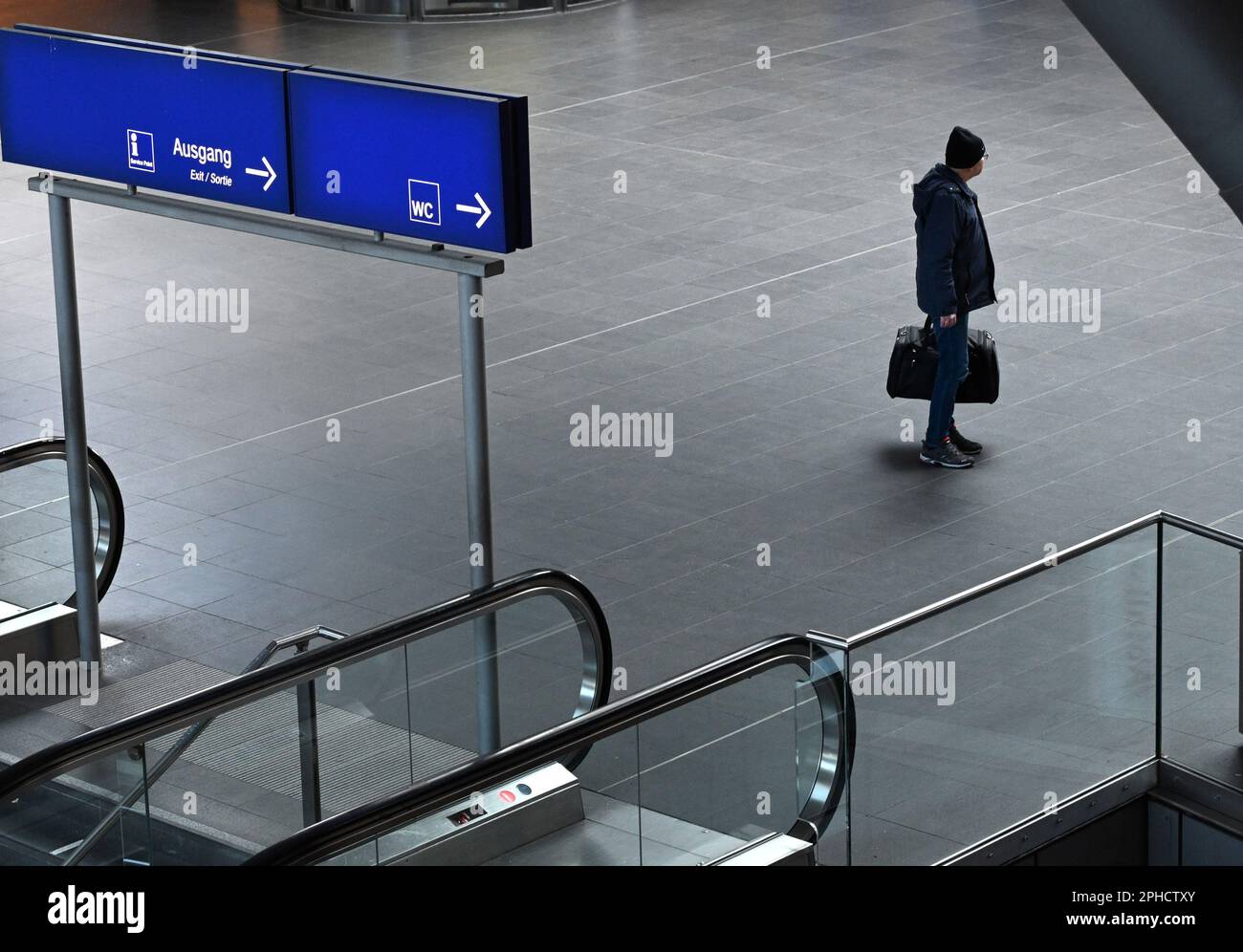 Berlin, Germany. 27th Mar, 2023. A man is seen at Berlin Central Train Station in Berlin, Germany, on March 27, 2023. Nationwide strikes in Germany brought train, bus, and airplane traffic to a virtual standstill on Monday, affecting millions of travelers. Freight traffic was also heavily disturbed. Credit: Stefan Zeitz/Xinhua/Alamy Live News Stock Photo