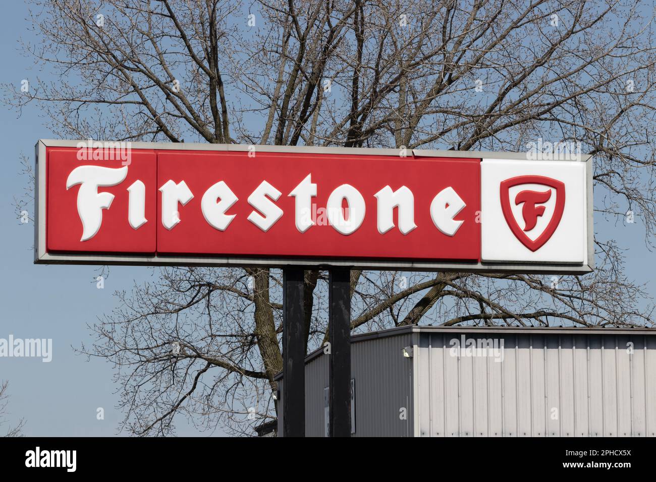 Fishers - Circa March 2023: Firestone Tire sign. Firestone is the official tire of IndyCar and the Indianapolis 500. Stock Photo