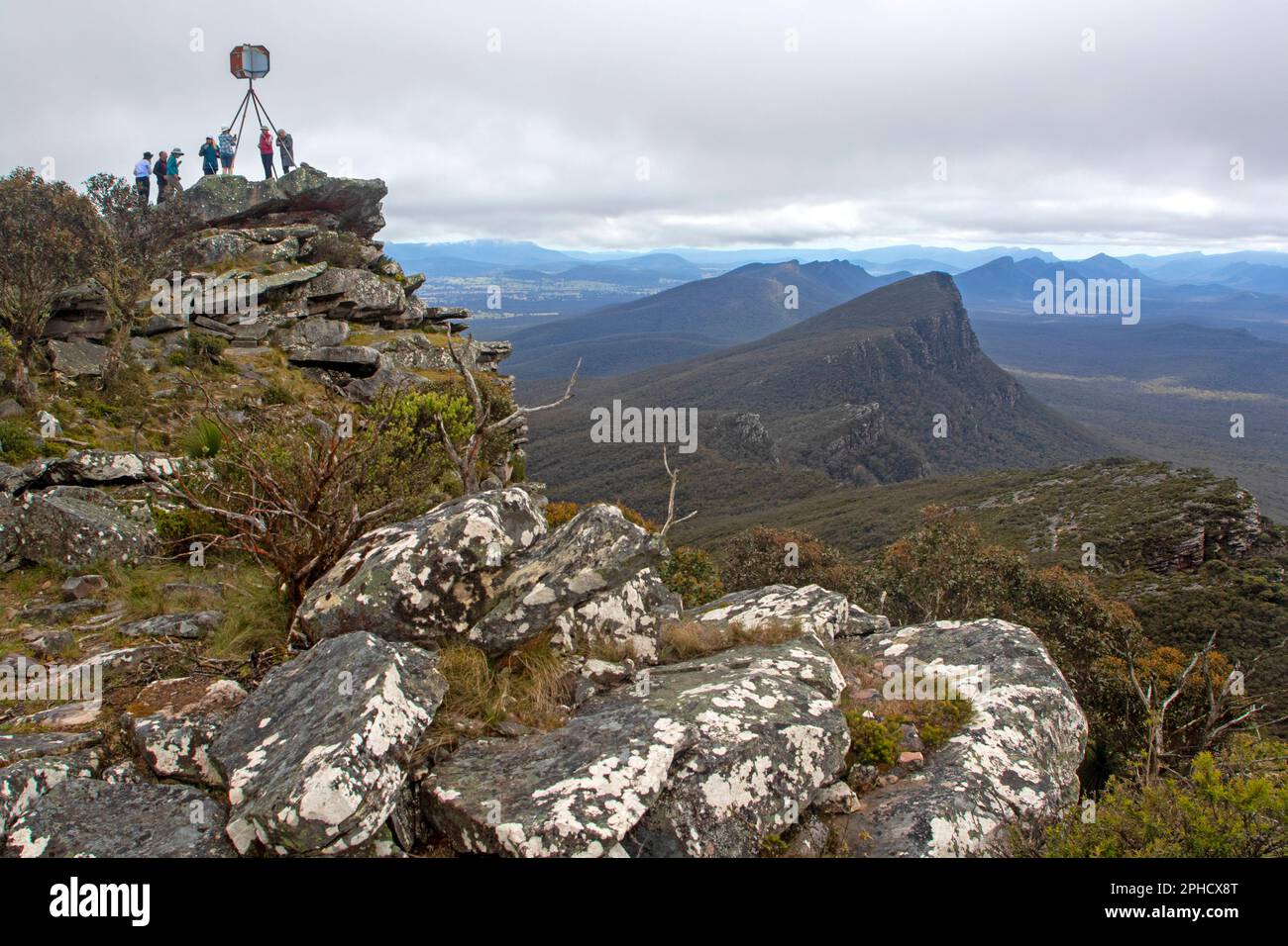 Hikers on the summit of Mt Abrupt, Grampians (Gariwerd) National Park Stock Photo