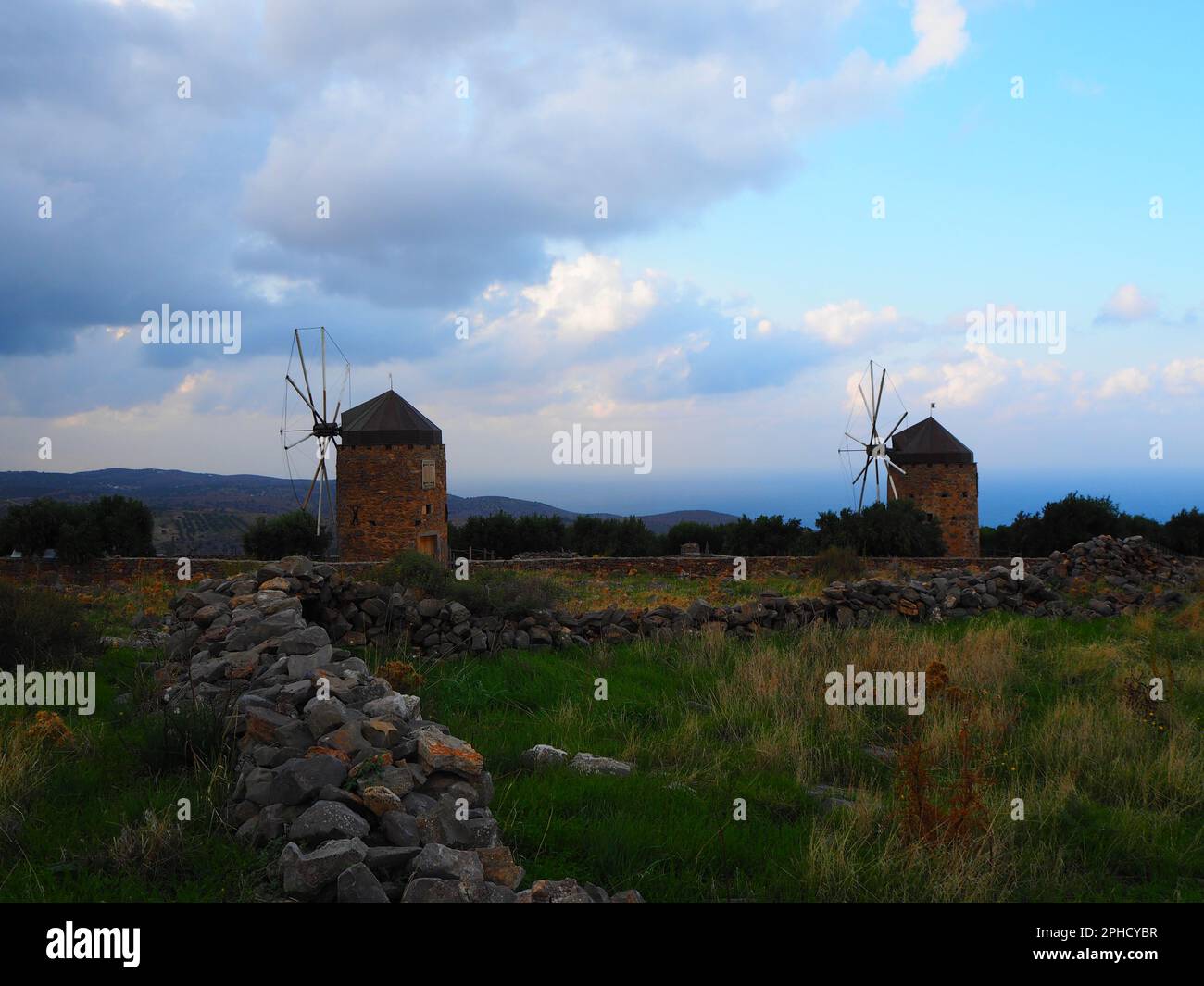 Windmill in Crete on a Road Trip, Mediterranean Sea, Travel Greece Stock Photo