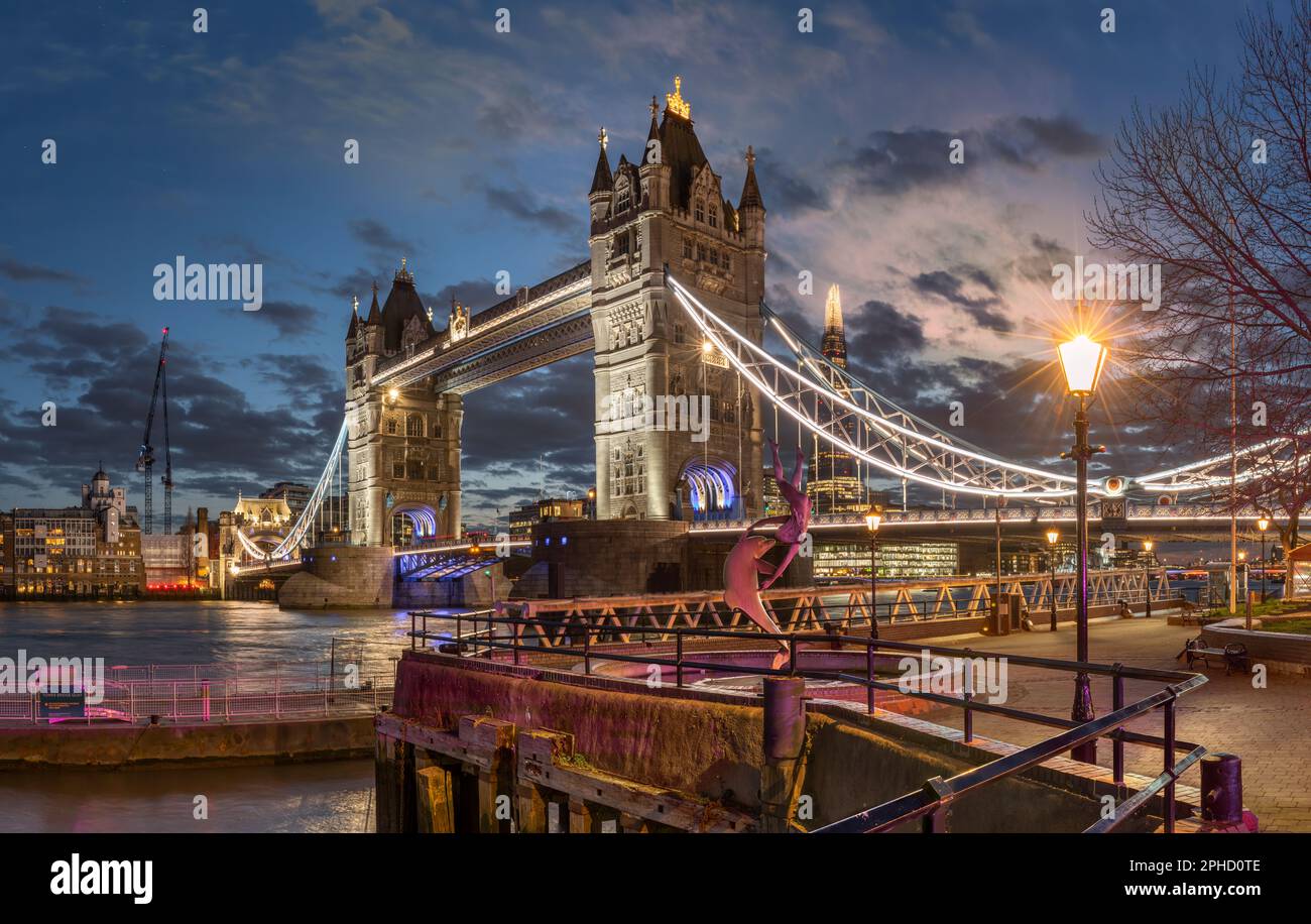 Tower Bridge at dusk - The iconic Tower Bridge, recognised throughout the world, is a Grade I Listed building and crosses the River Thames near the To Stock Photo