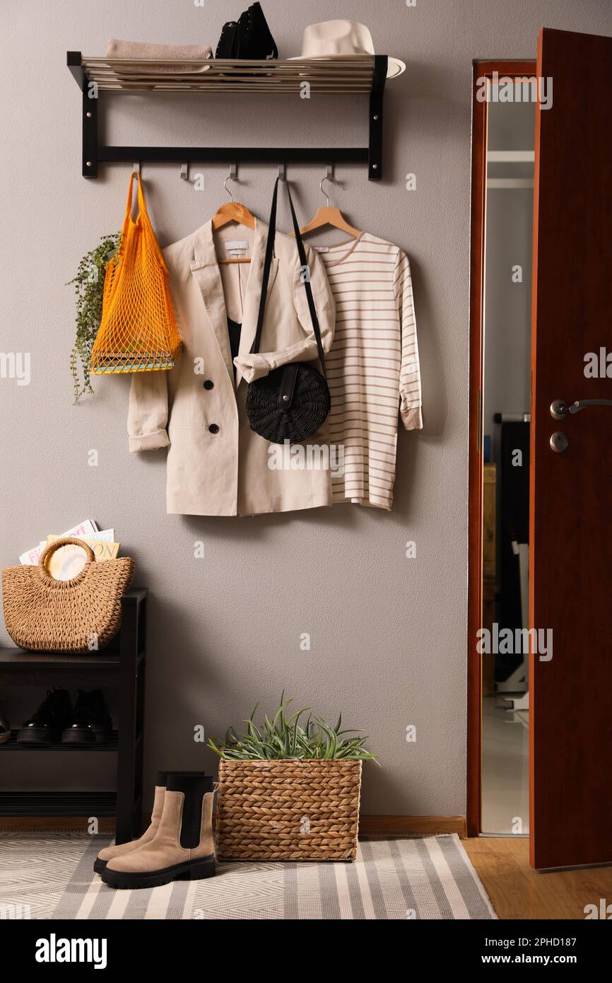 Hallway interior with stylish furniture, clothes and accessories Stock ...