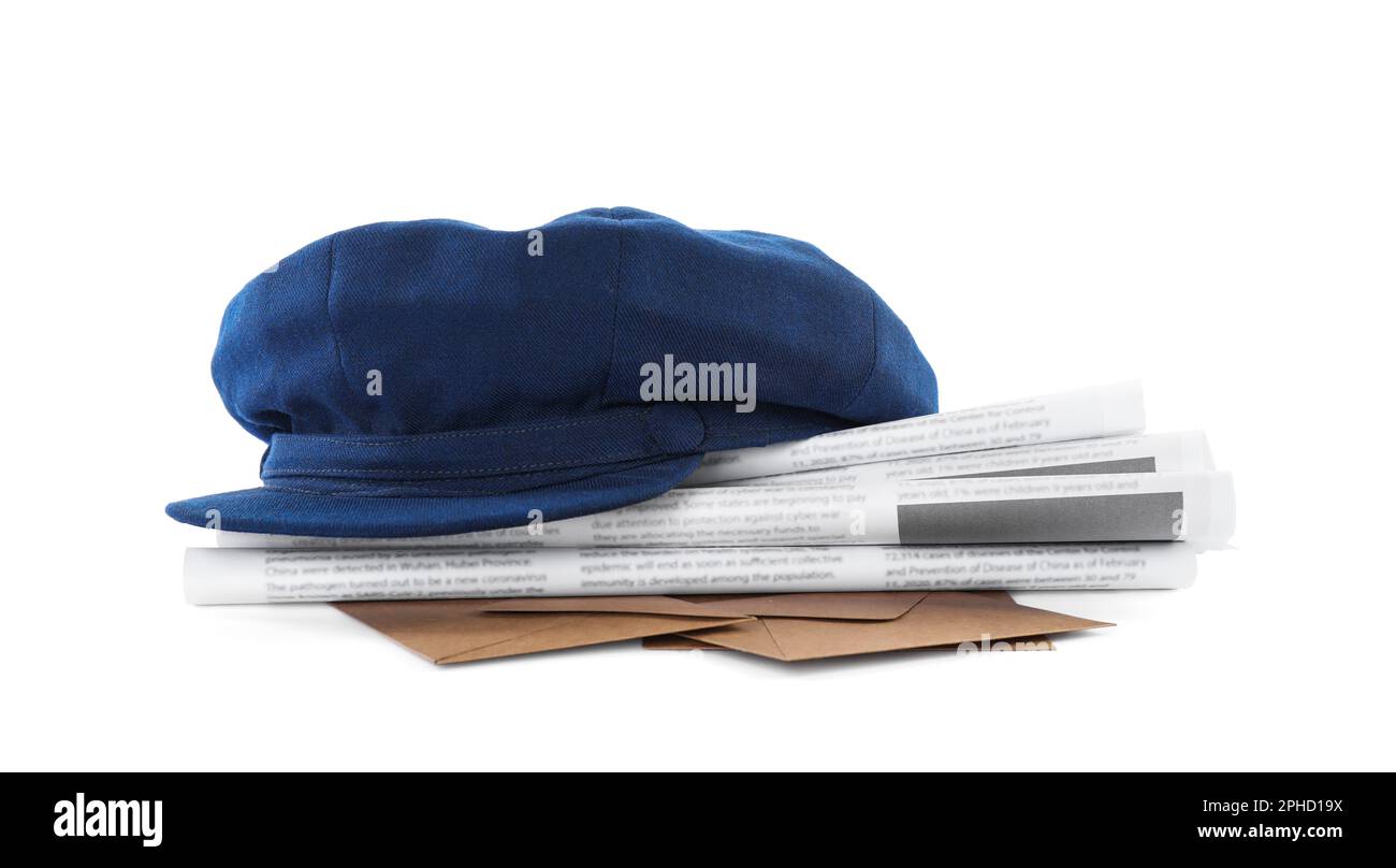 Blue postman's hat, envelopes and newspapers on white background Stock