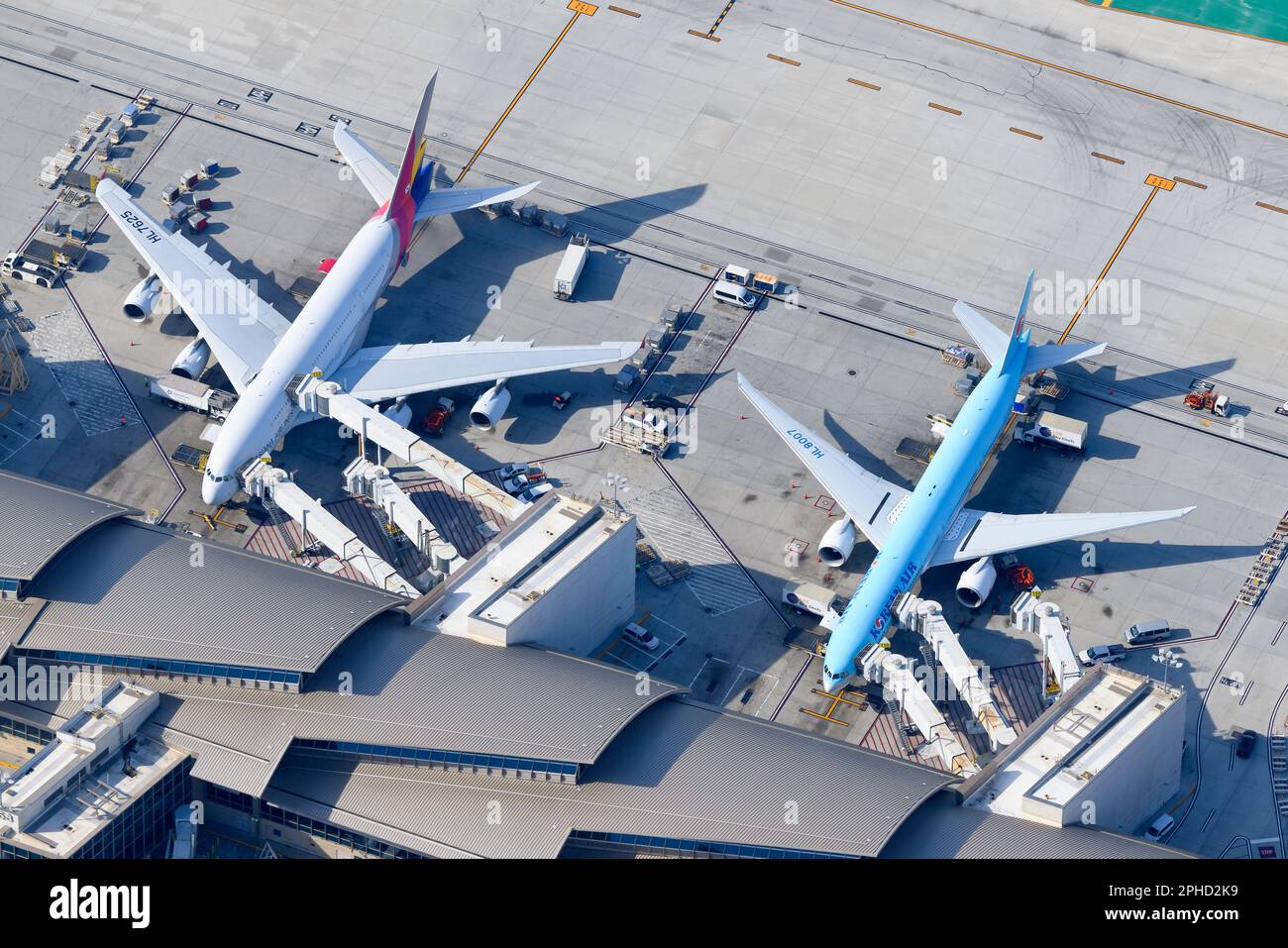 Asiana Airlines Airbus A380 and Korean Air Boeing 777 aircraft side by side. Airlines from South Korea bound to merger. Asiana and Korean Air planes. Stock Photo