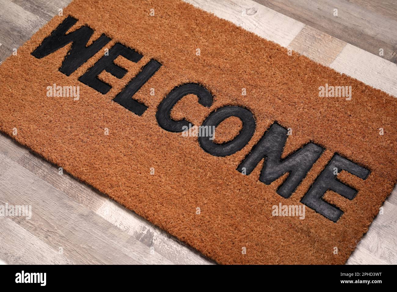 New clean mat with word on floor, closeup Stock Photo Alamy