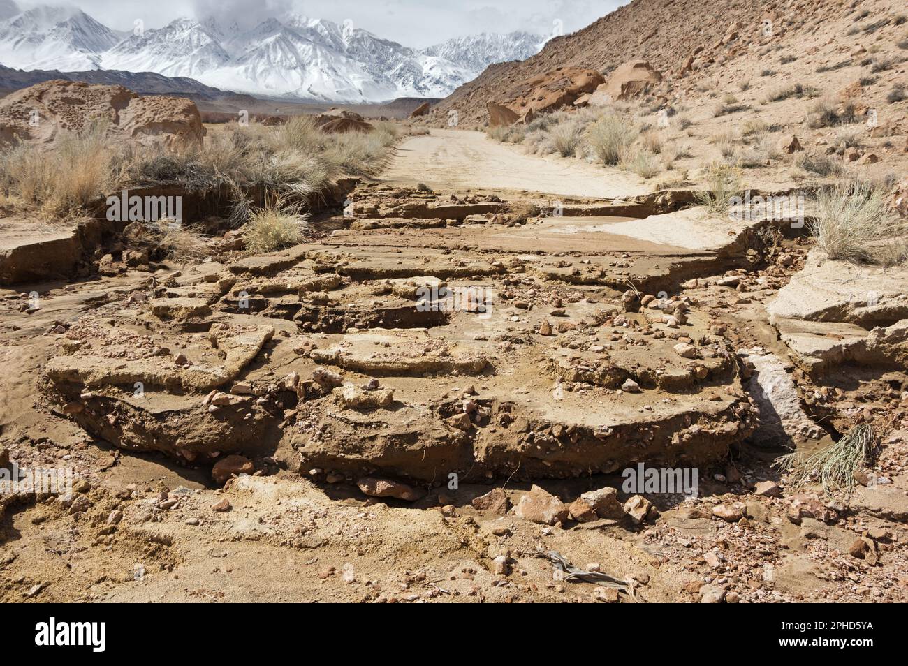 atmospheric river flood damage washed out Chalk Bluff dirt road in the Owens Valley of California Stock Photo