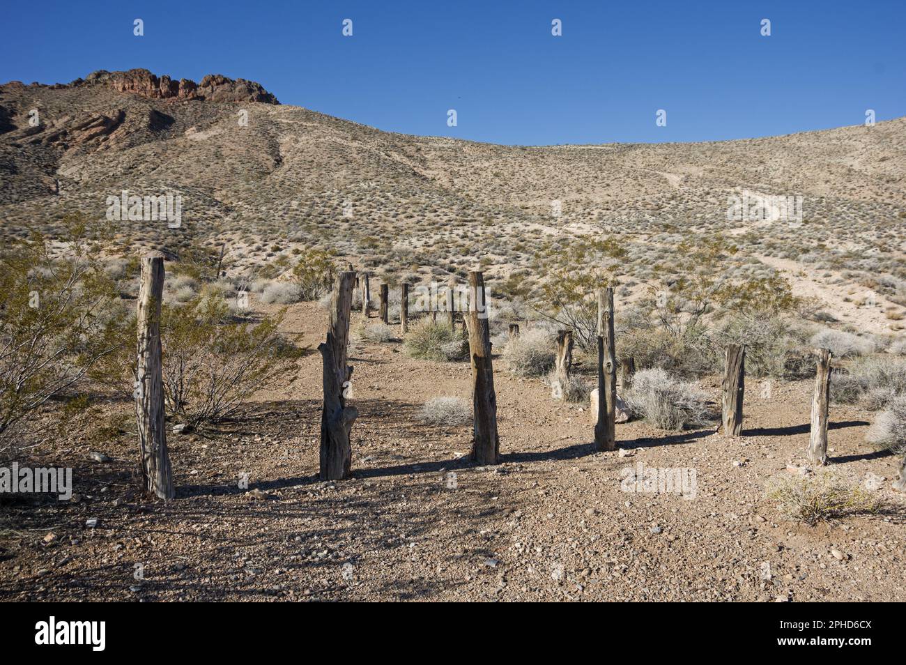Muddy Mountains Wilderness boundary marked by poles blocking the road Stock Photo