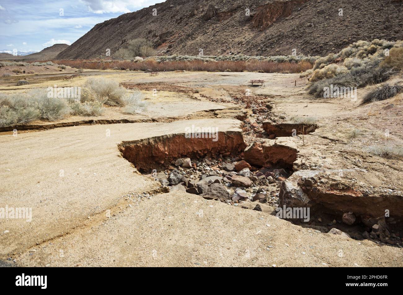 road washout from flood waters at the Pleasant Valley Campground in the Owens Valley of California Stock Photo