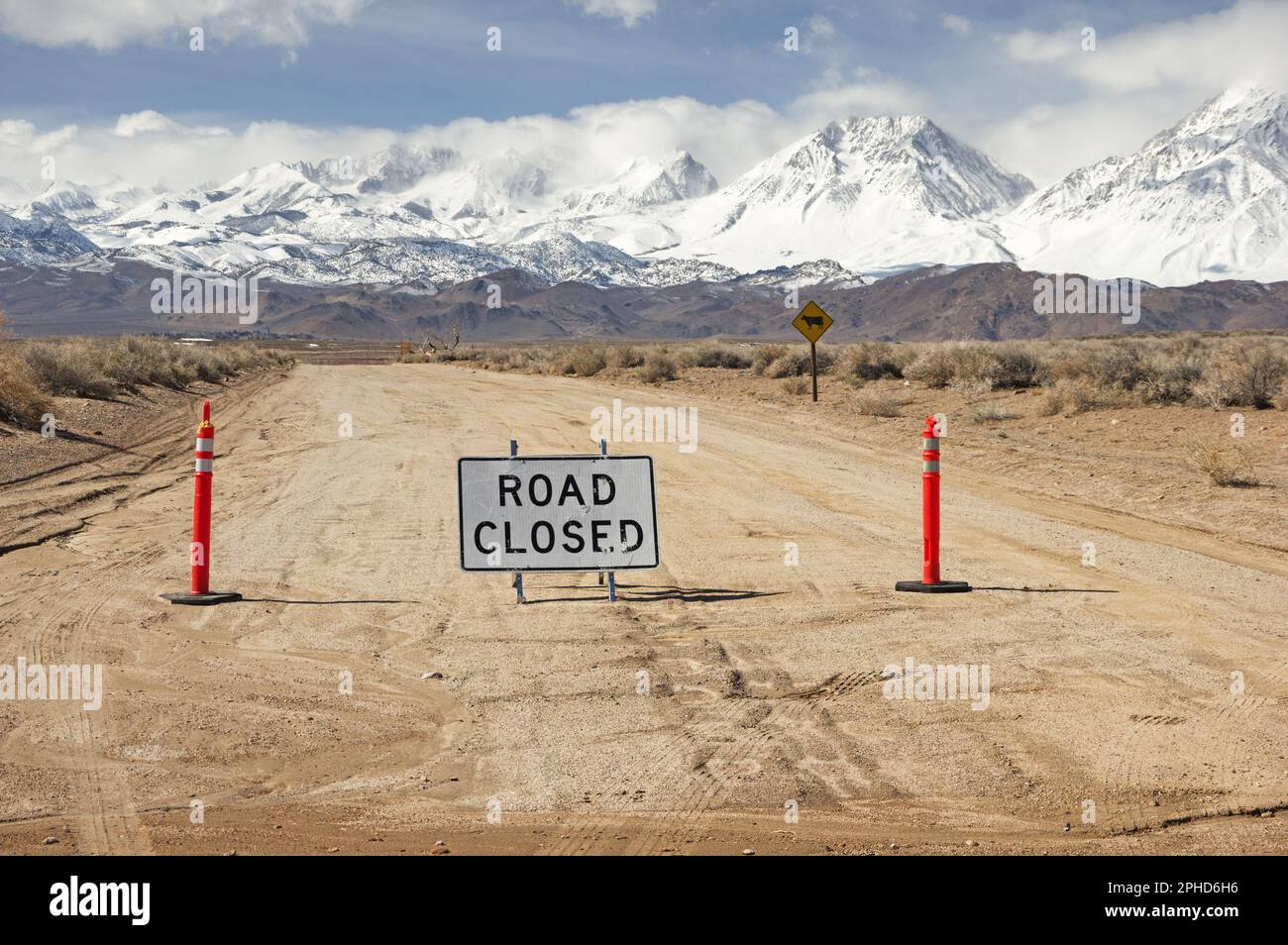 Chalk Bluff dirt road closed off because of atmospheric river flood damage with the Sierra Nevada Mountains near Bishop California Stock Photo