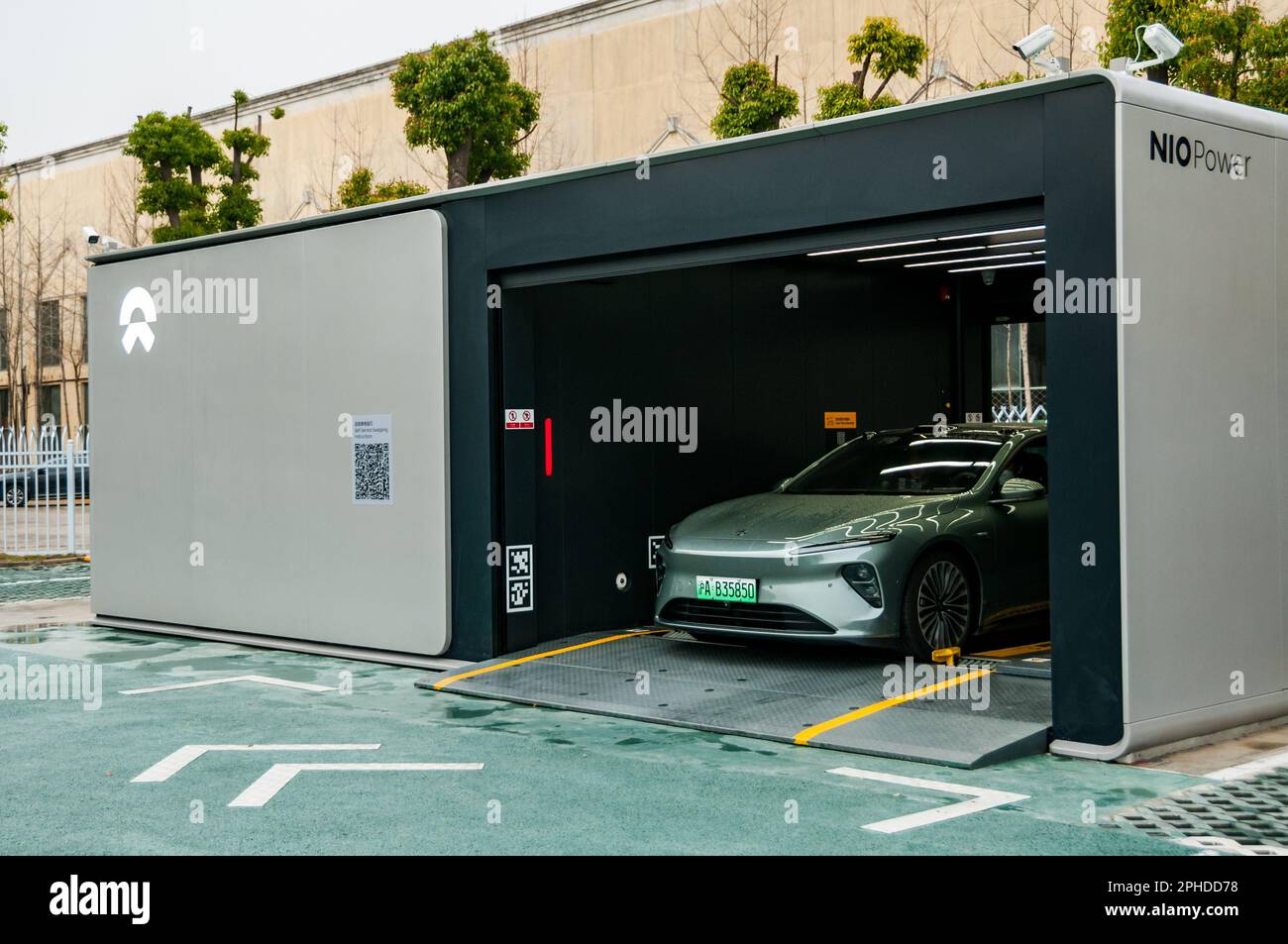 A Nio ET7 undergoing battery swapping with the Nio Power Swap Station 3.0 installed at the Nio Delivery Center, Nanxiang, Jiading District, Shanghai, Stock Photo