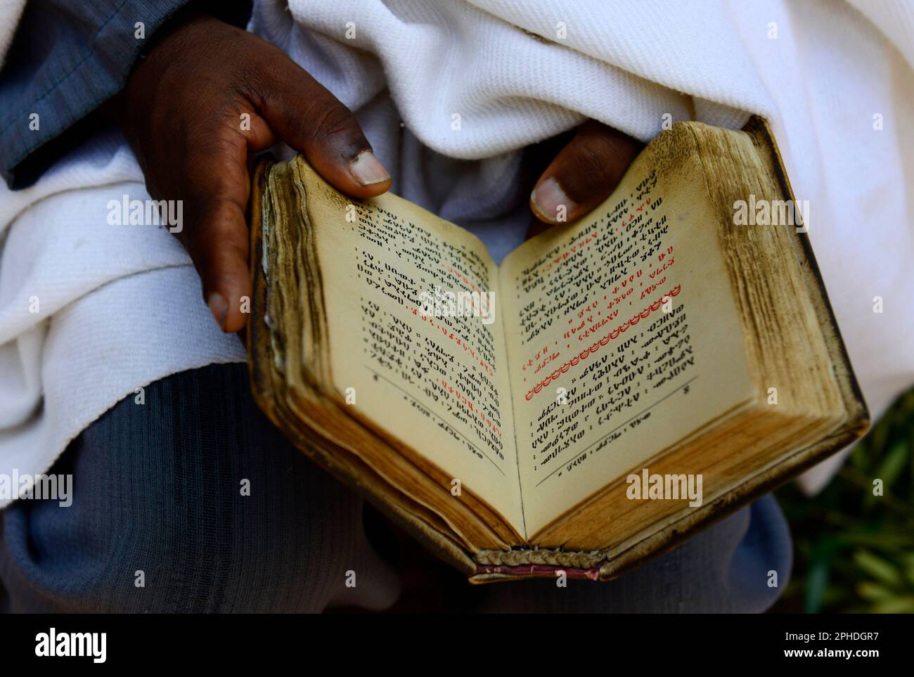 Ethiopian Pilgrim reading the bible ( written in Geʽez )Church of Saint