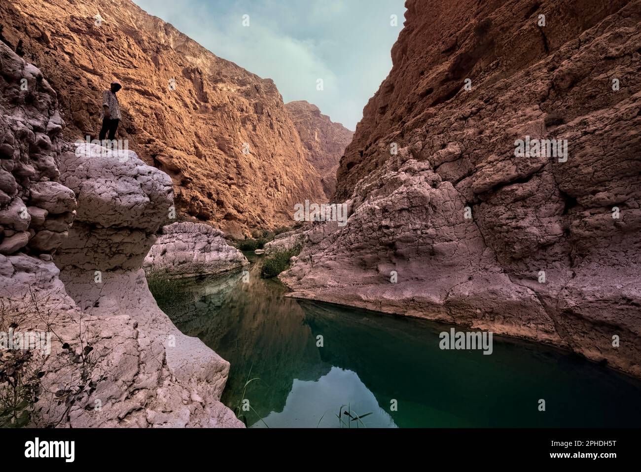 Hiker inside the beautiful Wadi Shab canyon, Wadi Ash Shab, Oman Stock