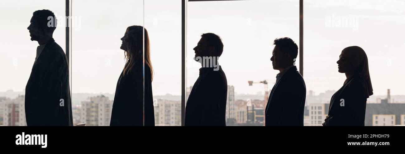 Silhouette photo of a group of businessmen standing side by side in ...