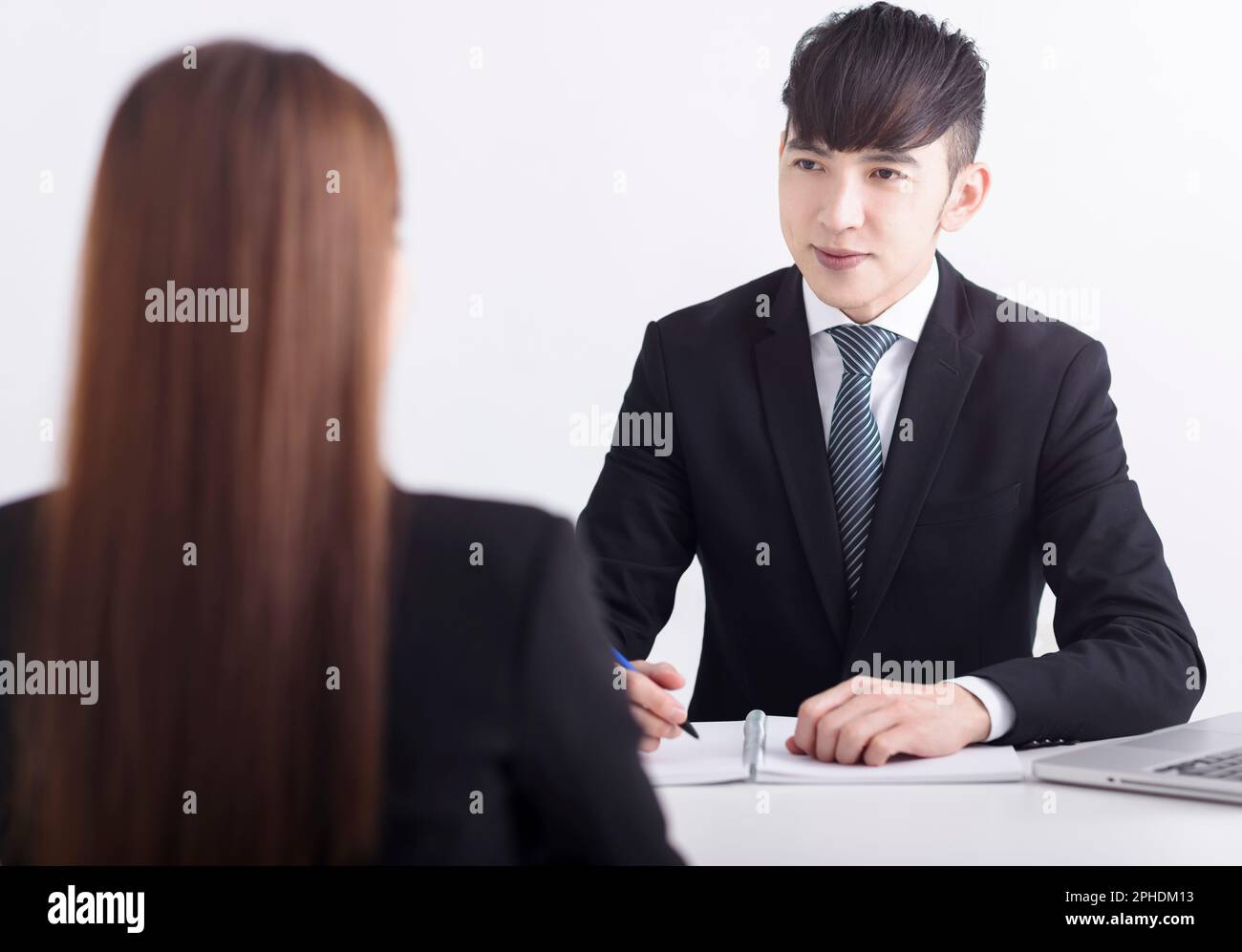 Business manager interviewing young women job applicant in the office Stock Photo