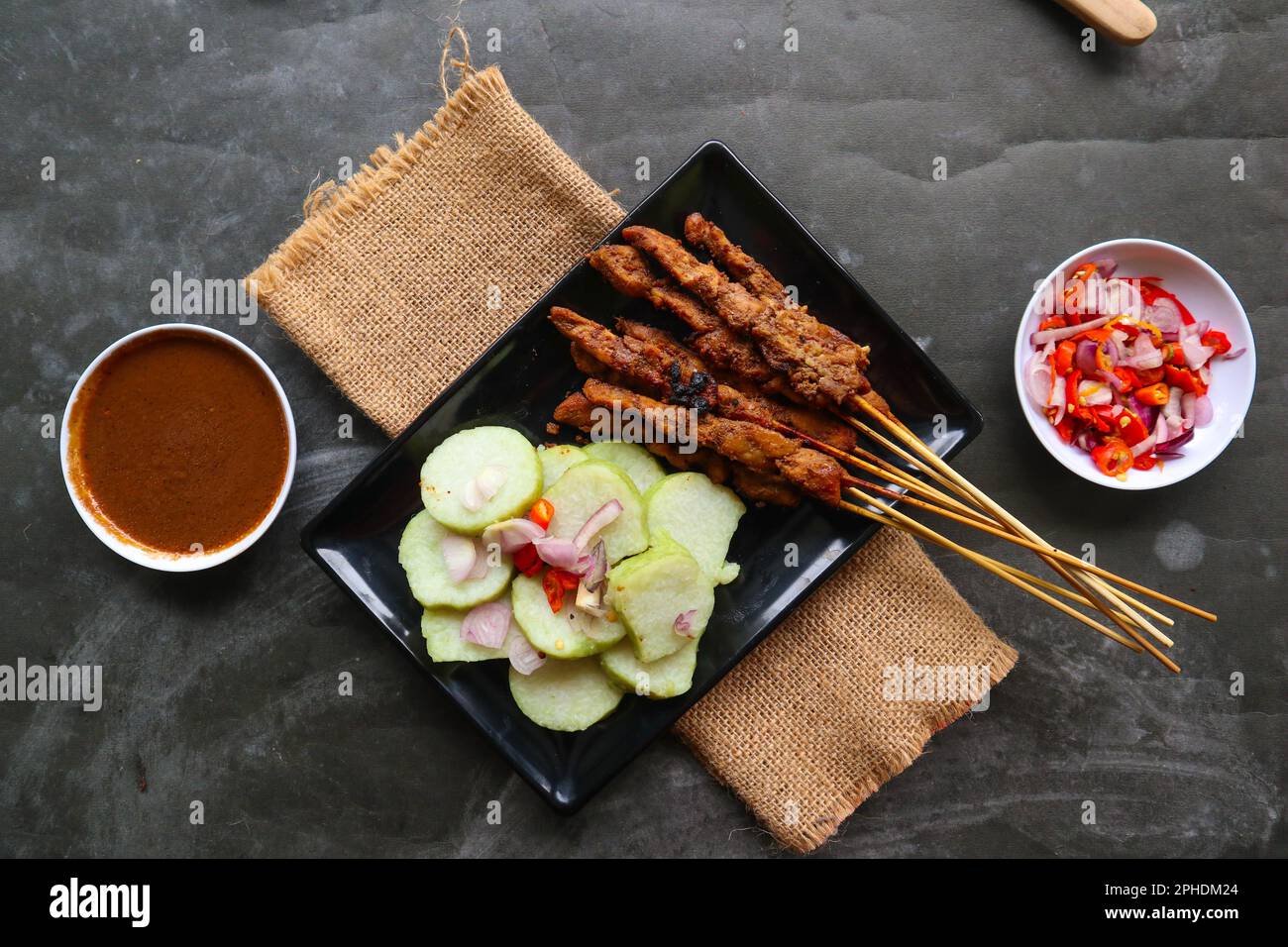 chicken satay or chicken satay served with lontong, rice cake and