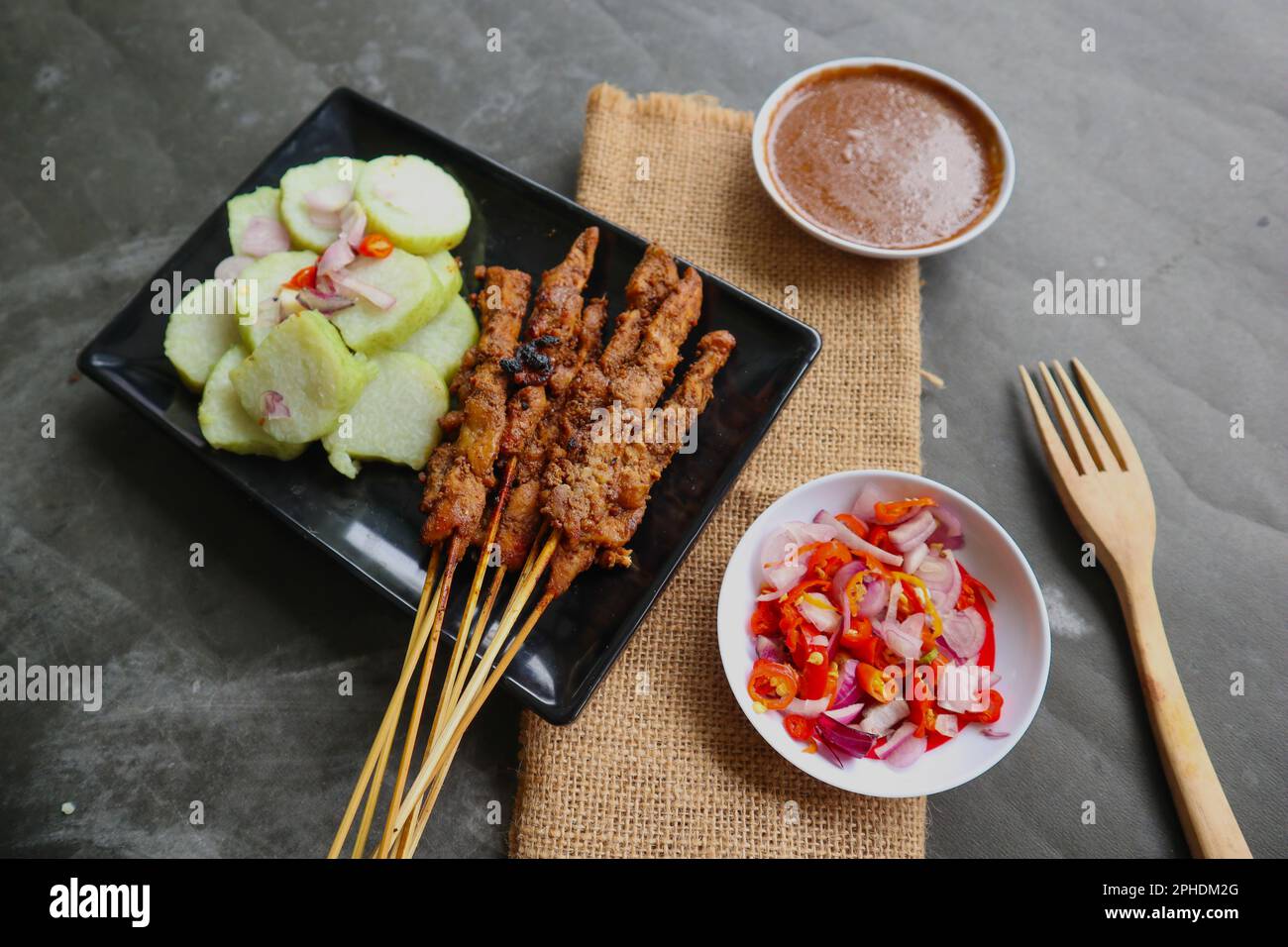 chicken satay or chicken satay served with lontong, rice cake and peanut sauce Stock Photo Alamy
