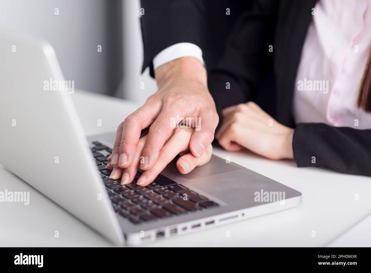 Business man touching woman hand feeling disgusted and uncomfortable. Sexual harassment inappropriate at office Stock Photo