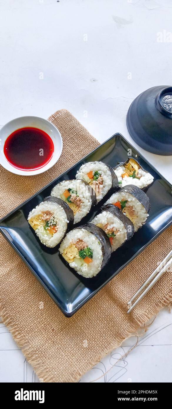 kimbap or gimbap is Korean roll Gimbap(kimbob) made from steamed white rice (bap) and various other ingredients, this food from south korea Stock Photo