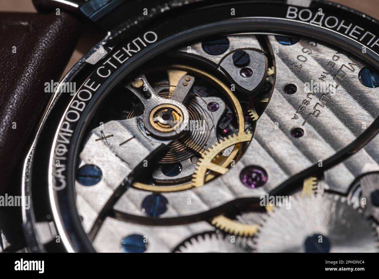 Chelyabinsk, Russia - January 10, 2023: Details of Molnyja movement 3603. Balance wheel close up. Back side of the gents wrist watch Rarity Green with Stock Photo