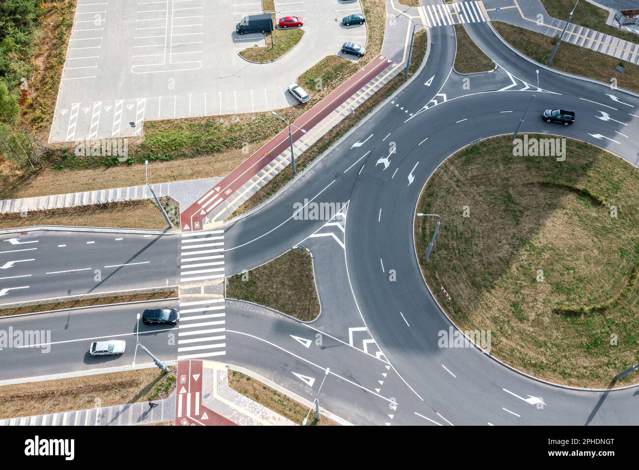 modern roundabout junction with little traffic of cars. aerial view from flying drone. Stock Photo