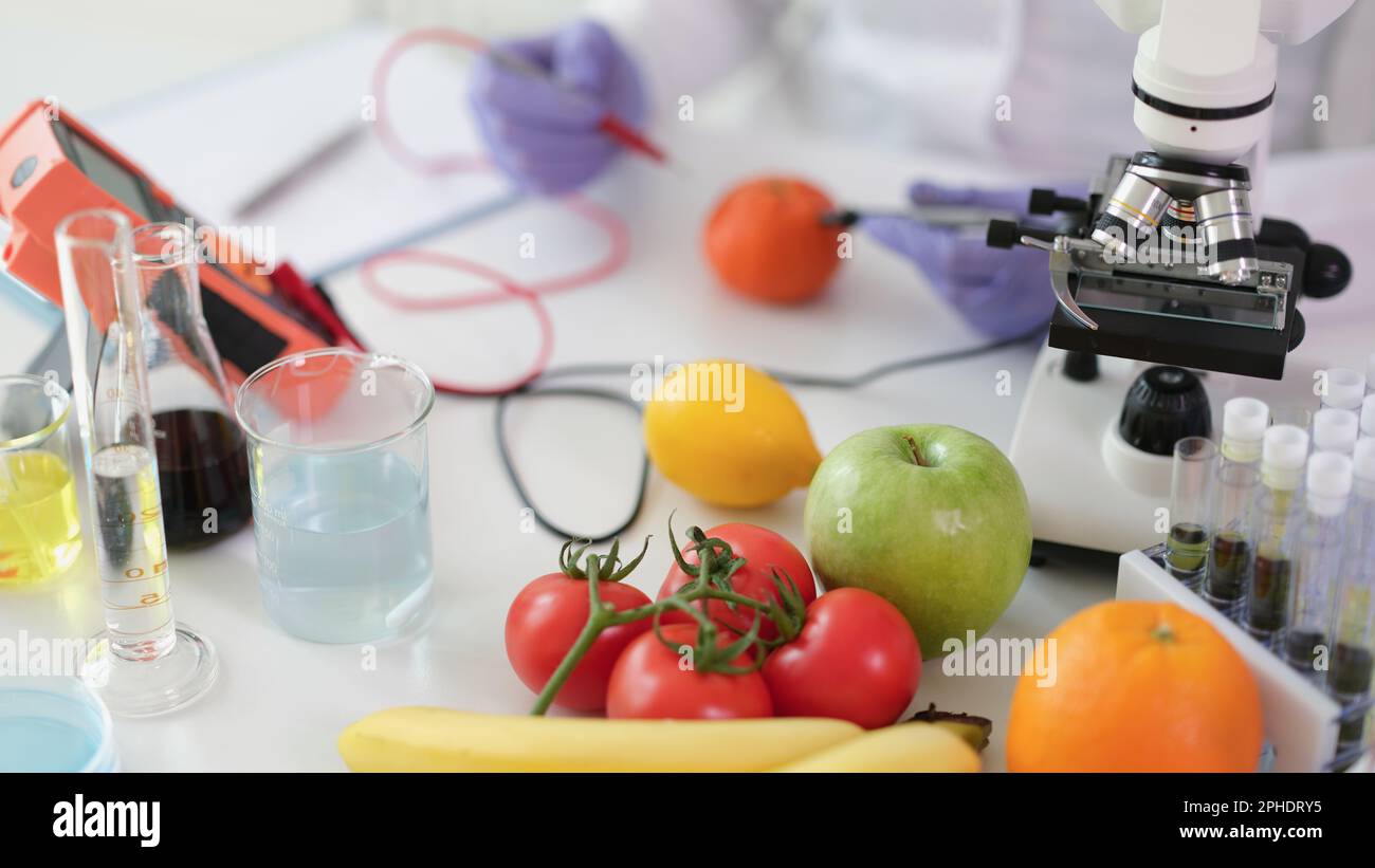 Scientist chemist studying amount of toxic substances in vegetables and
