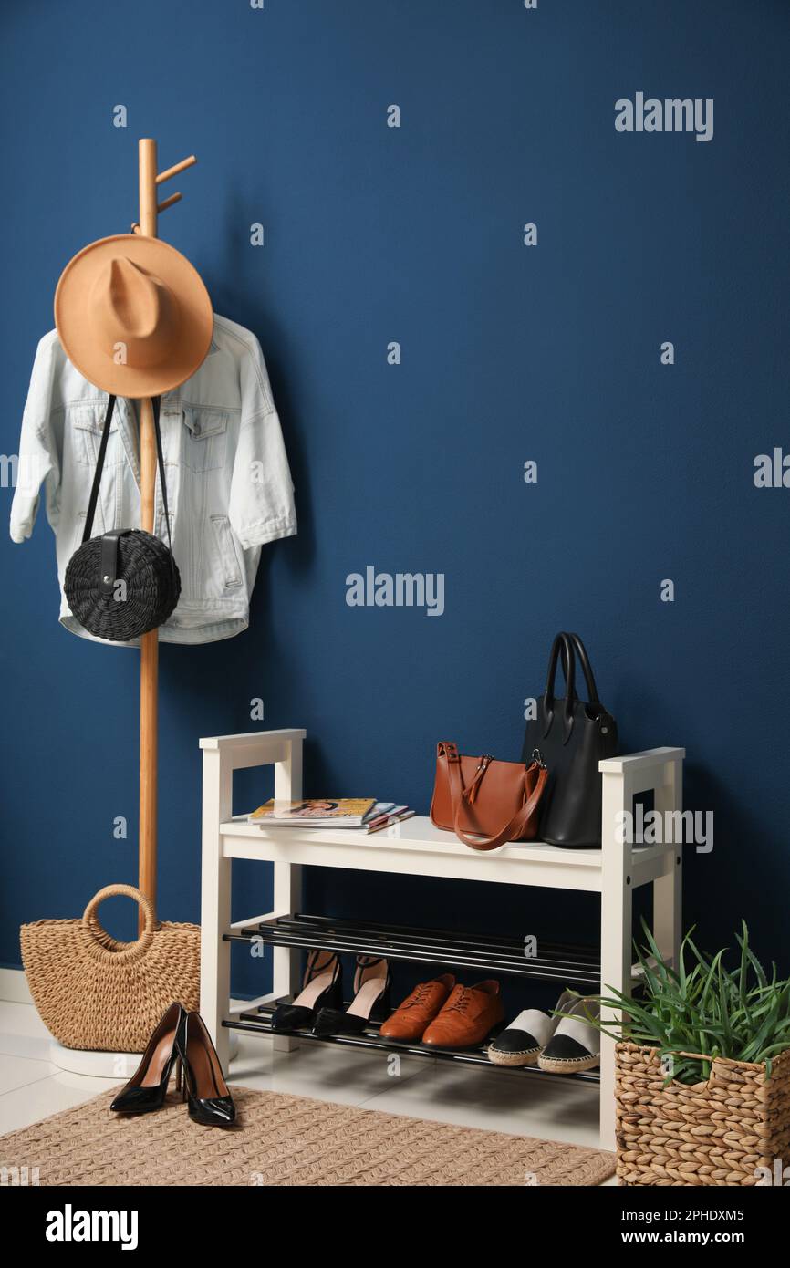 Hallway interior with stylish furniture, clothes and accessories Stock ...